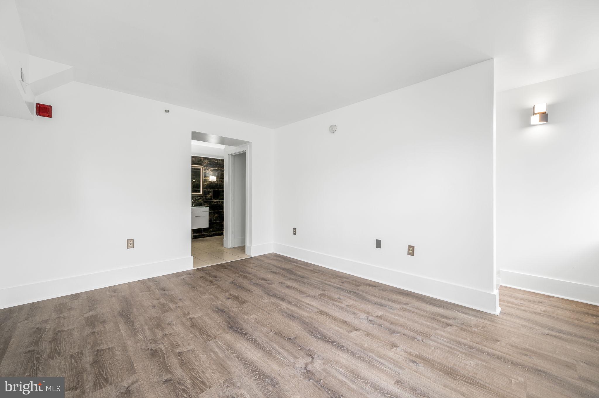 1201 South 5th Street Philadelphia, PA 19147 - Photo 21 of 57 a view of an empty room with wooden floor and closet