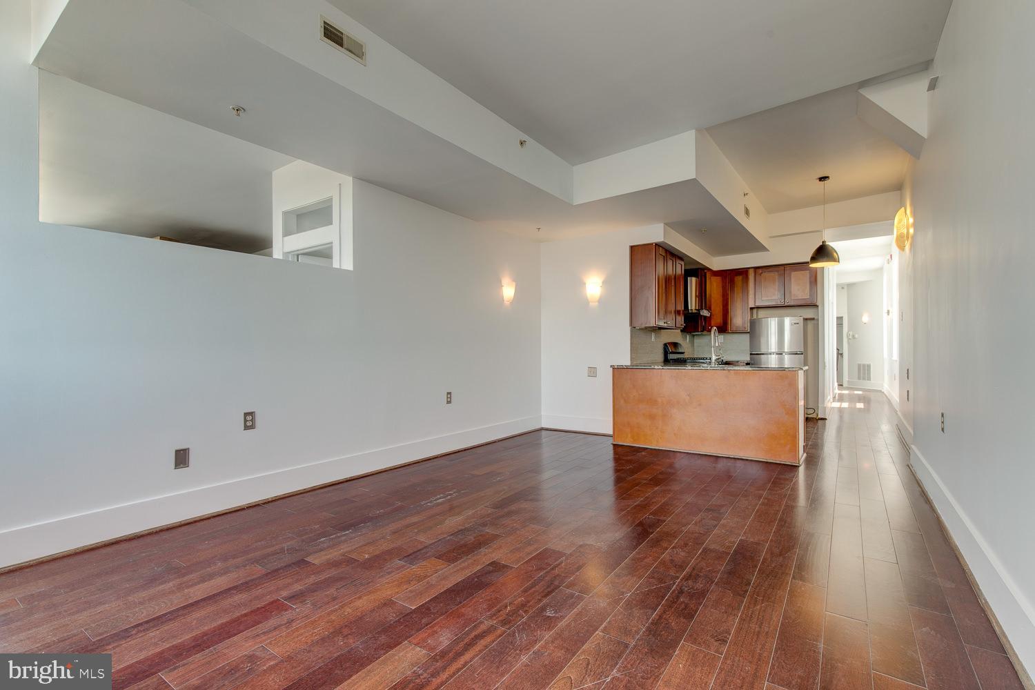 1201 South 5th Street Philadelphia, PA 19147 - Photo 44 of 57 a view of a kitchen with wooden floor and a sink
