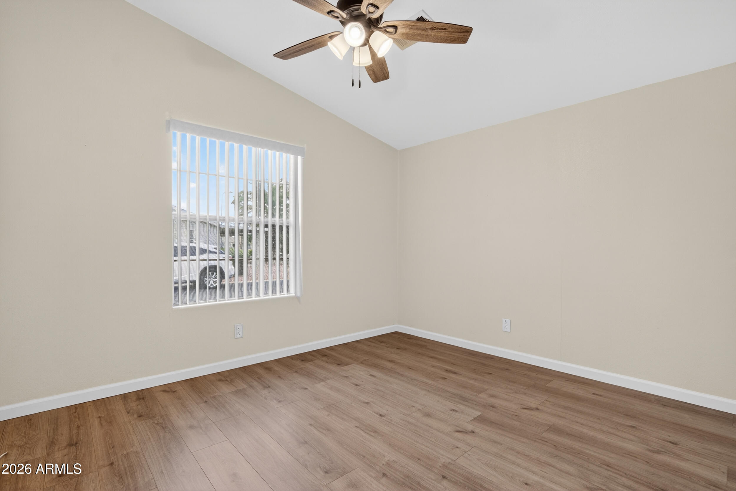 2550 South Ellsworth Road, Unit 396 Mesa, AZ 85209 - Photo 19 of 29 wooden floor in an empty room with a window