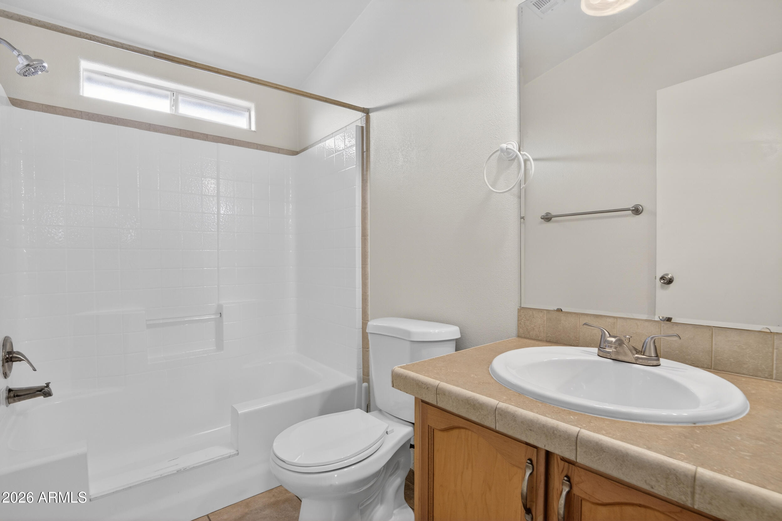 2550 South Ellsworth Road, Unit 396 Mesa, AZ 85209 - Photo 21 of 29 a bathroom with a sink toilet vanity and shower