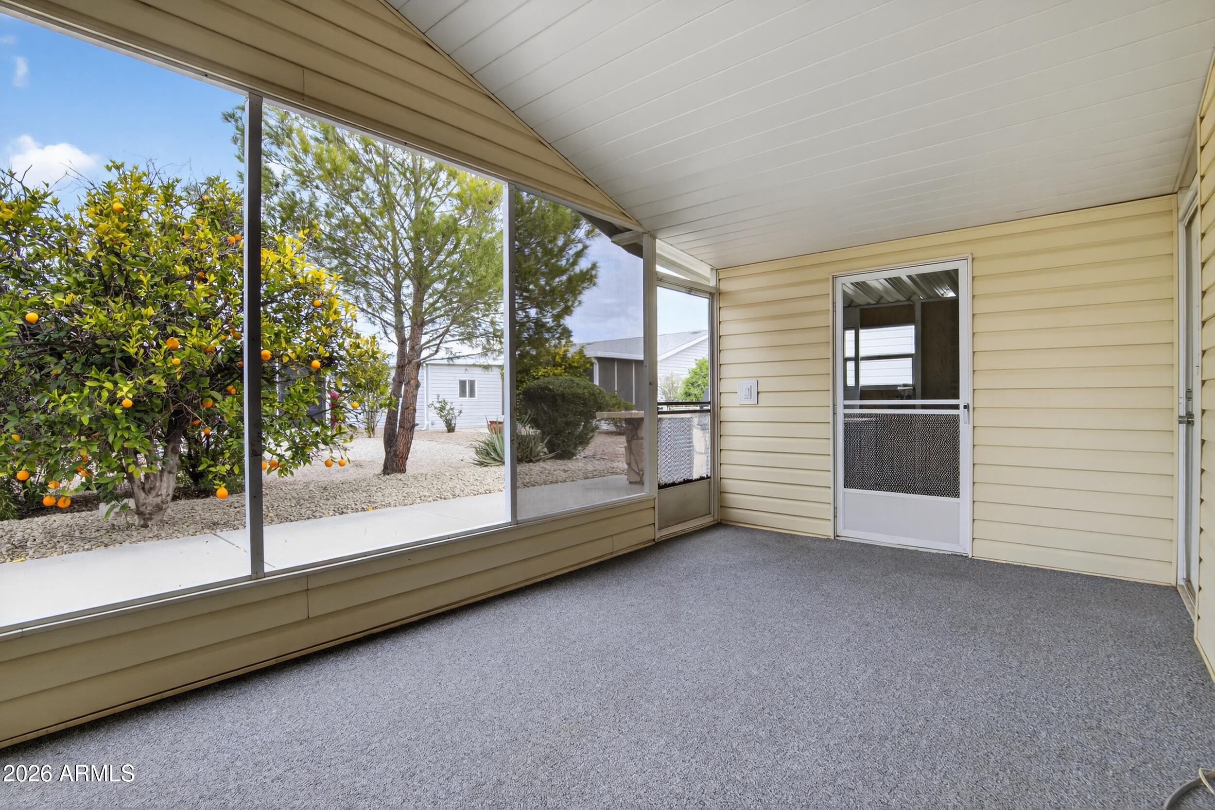 2550 South Ellsworth Road, Unit 396 Mesa, AZ 85209 - Photo 22 of 29 a view of empty room with floor to ceiling window and potted plants