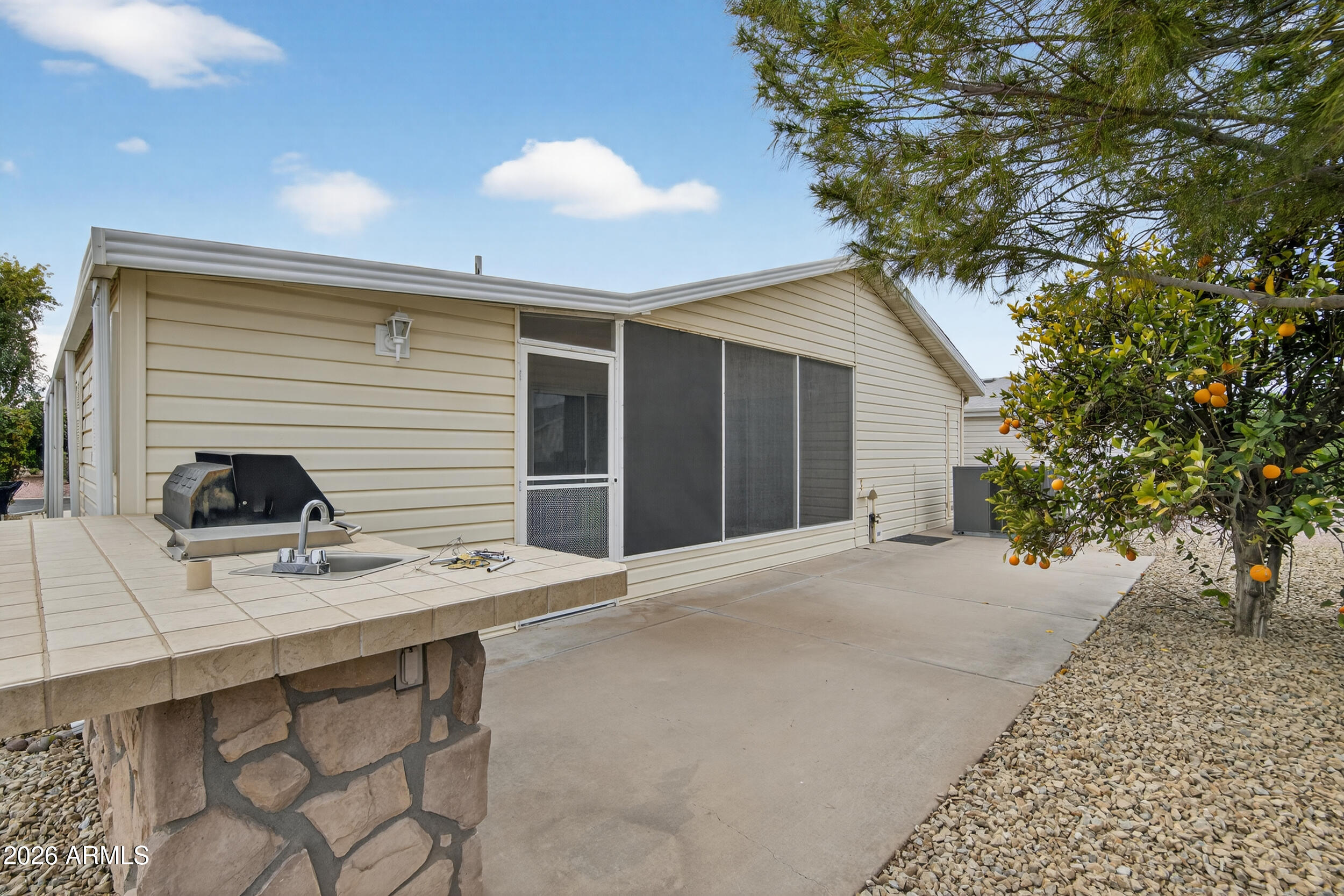2550 South Ellsworth Road, Unit 396 Mesa, AZ 85209 - Photo 27 of 29 a backyard of a house with seating space