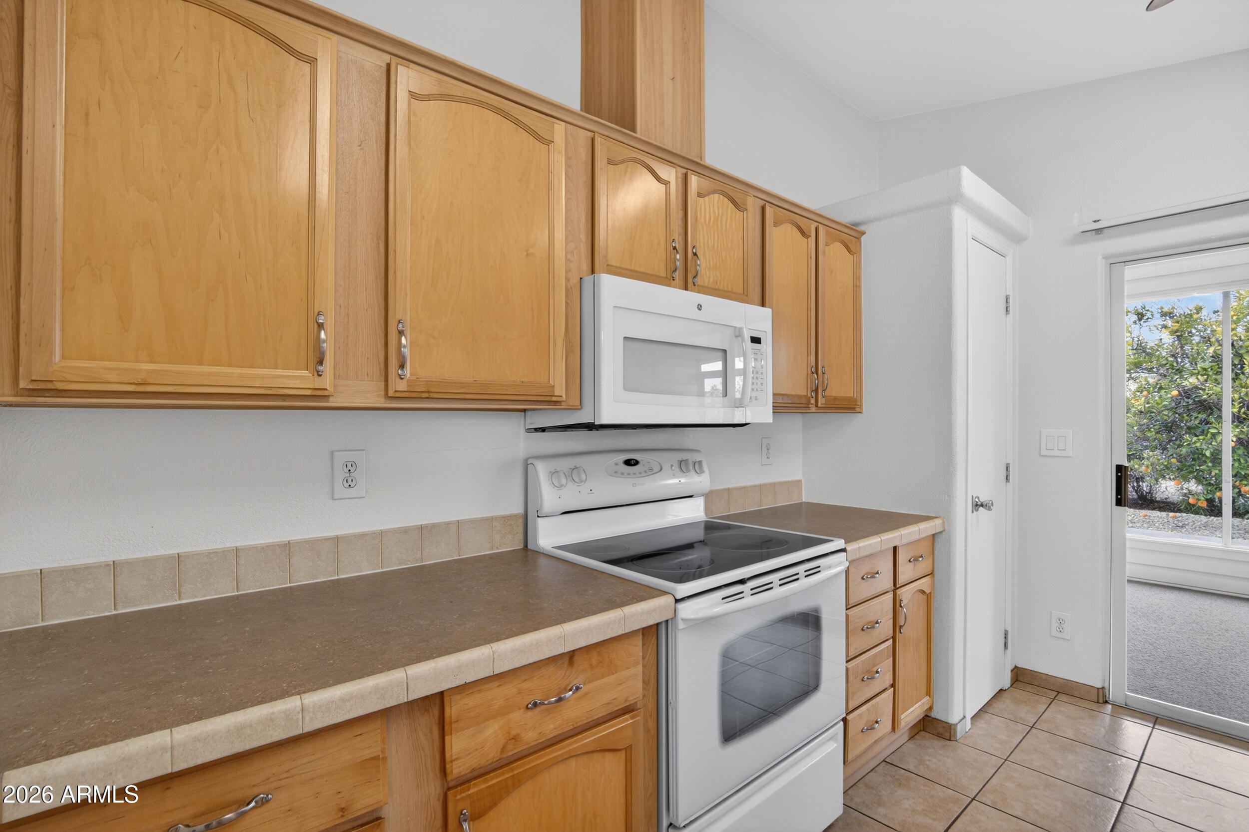 2550 South Ellsworth Road, Unit 396 Mesa, AZ 85209 - Photo 6 of 29 a kitchen with stainless steel appliances granite countertop a sink stove and cabinets