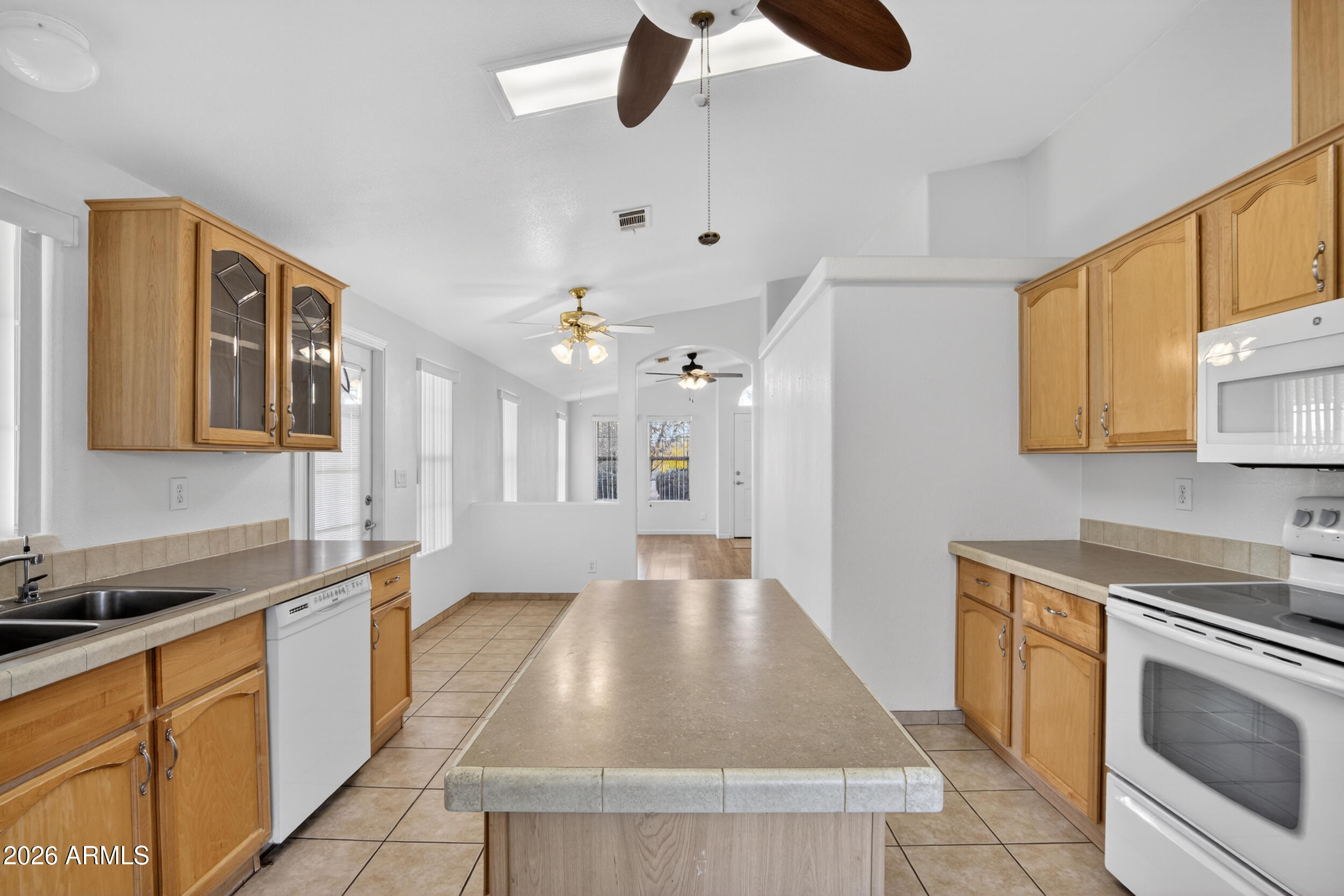 2550 South Ellsworth Road, Unit 396 Mesa, AZ 85209 - Photo 7 of 29 a kitchen with stainless steel appliances granite countertop a sink stove and refrigerator