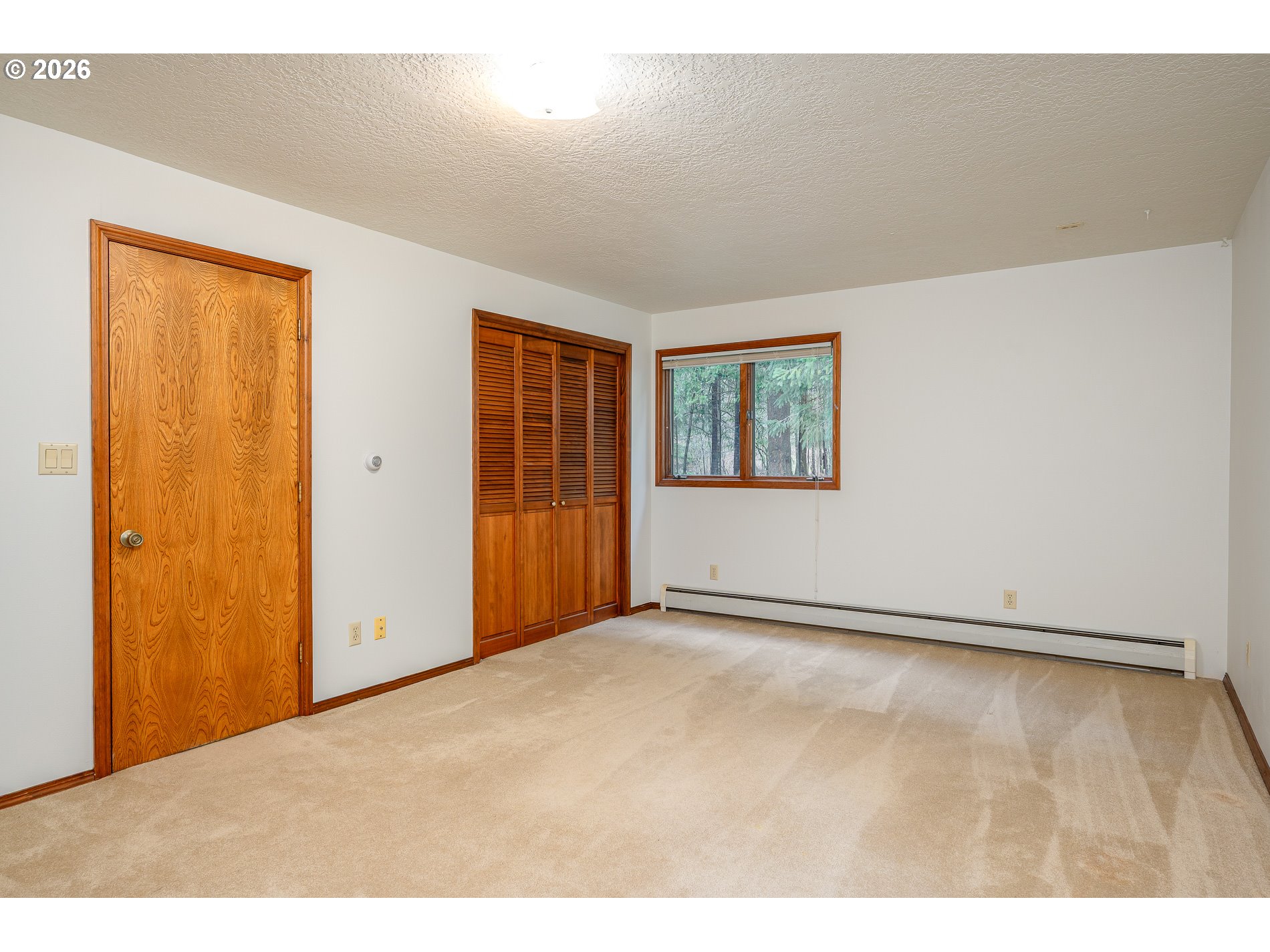 27572 South Kinzy Road Estacada, OR 97023 - Photo 14 of 47 a view of an empty room with a window