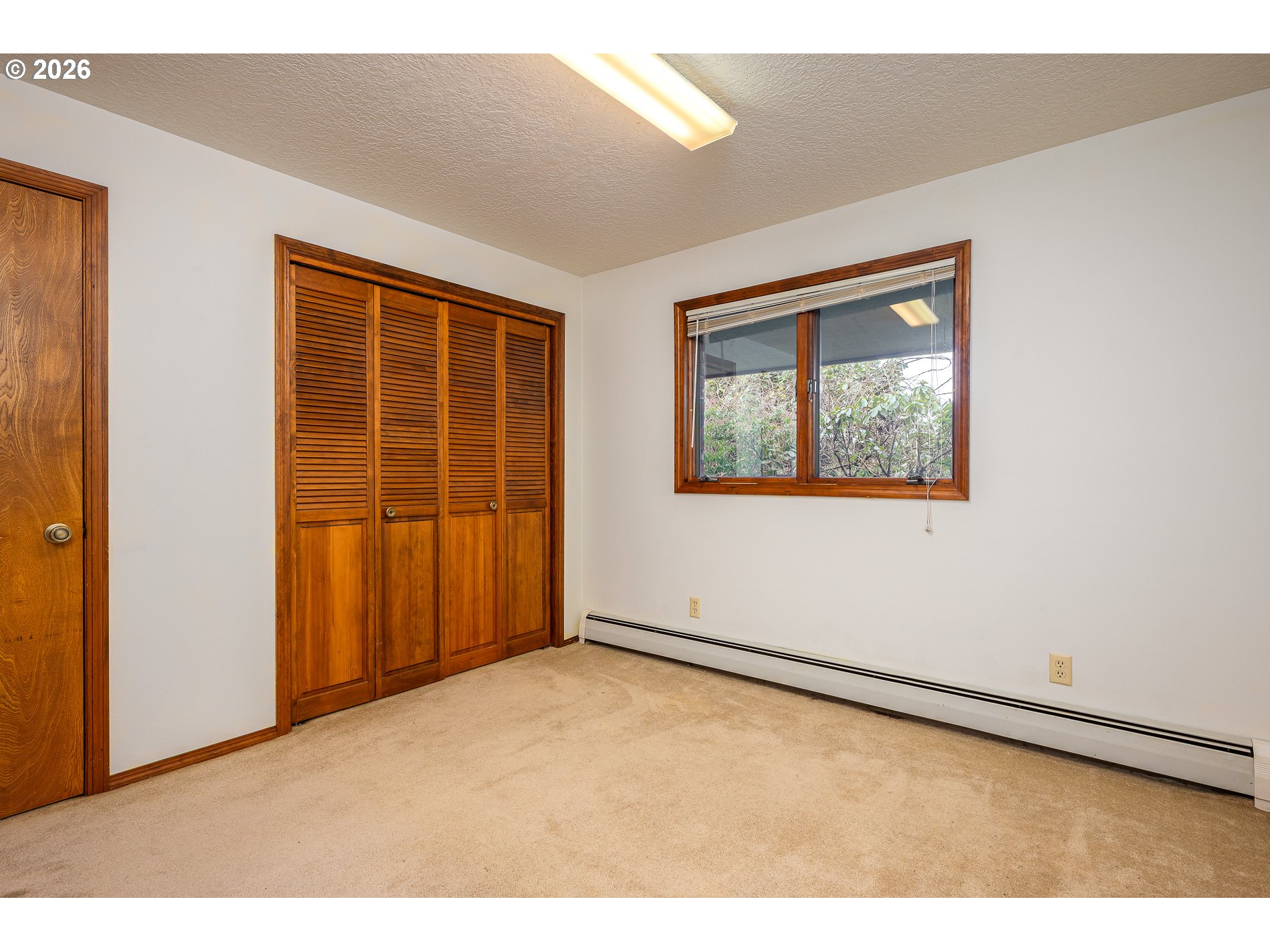 27572 South Kinzy Road Estacada, OR 97023 - Photo 18 of 47 a view of an empty room with a window