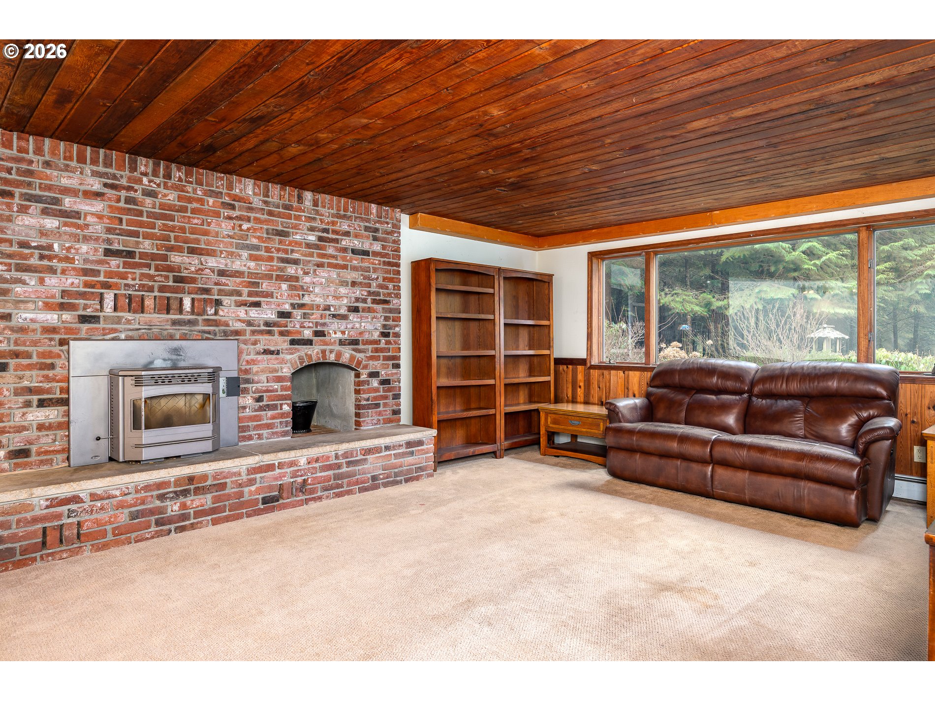 27572 South Kinzy Road Estacada, OR 97023 - Photo 21 of 47 a living room with furniture a fireplace and a table