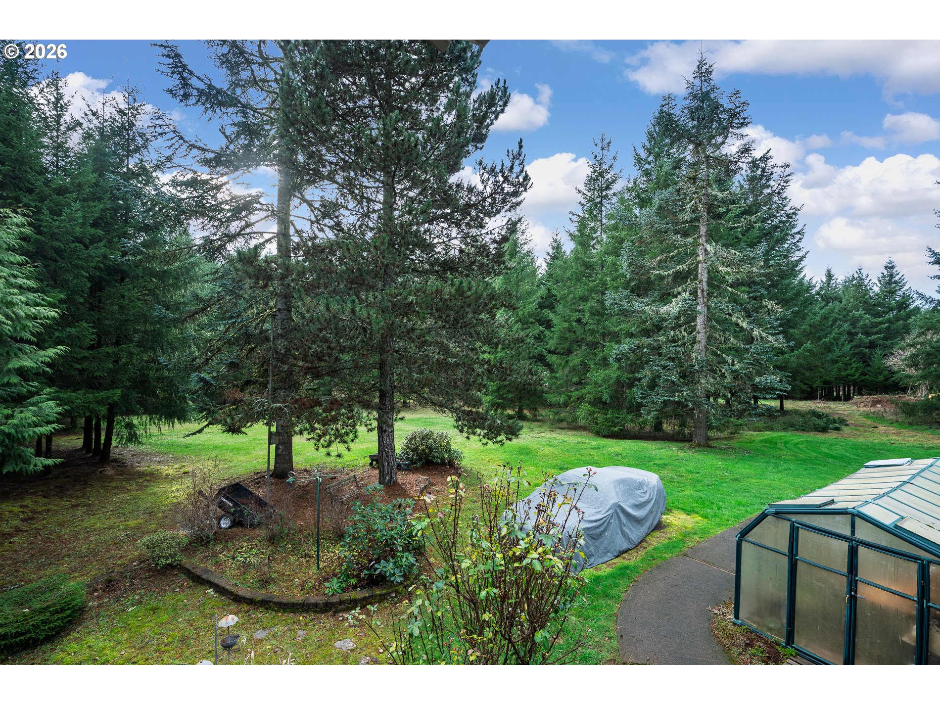 27572 South Kinzy Road Estacada, OR 97023 - Photo 39 of 47 a backyard of a house with a yard and outdoor seating