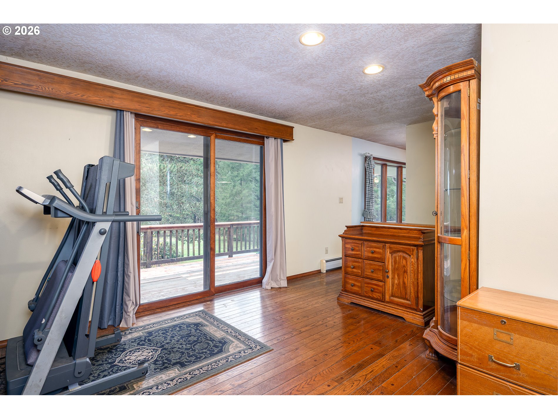 27572 South Kinzy Road Estacada, OR 97023 - Photo 5 of 47 a view of a hallway with wooden floor and furniture