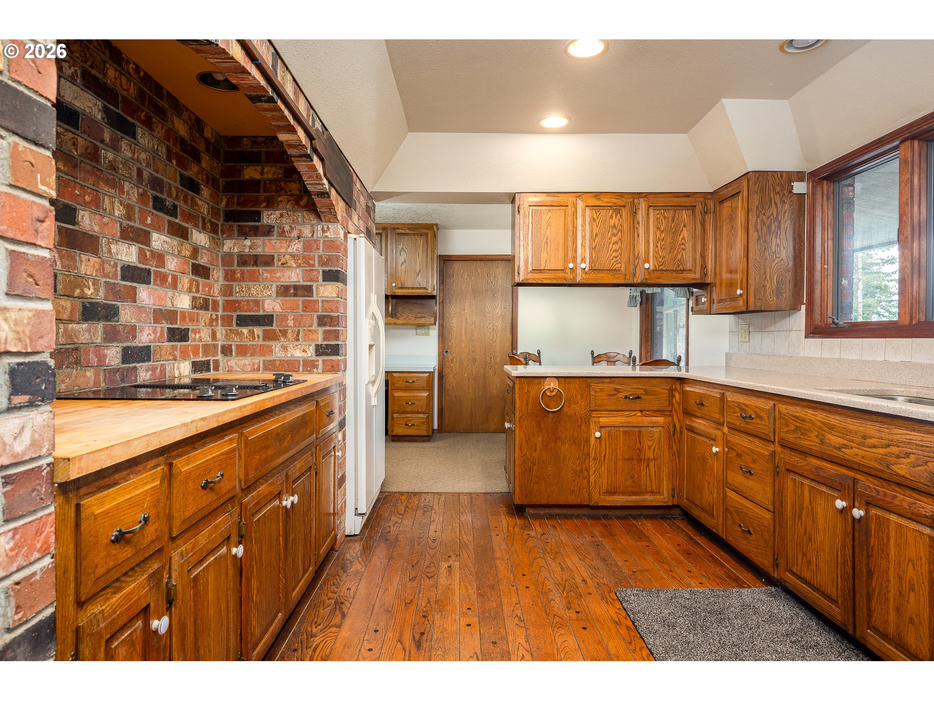 27572 South Kinzy Road Estacada, OR 97023 - Photo 8 of 47 a kitchen with stainless steel appliances wooden cabinets a stove and a refrigerator