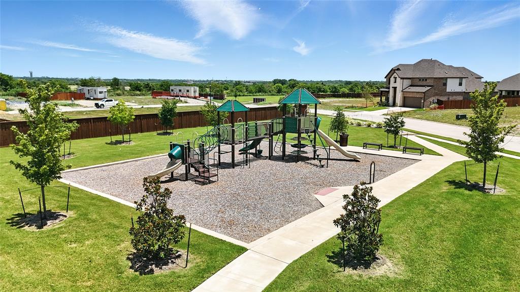 1246 Stockton Trail Red Oak, TX 75154 - Photo 24 of 29 a view of a house with a yard and lake view