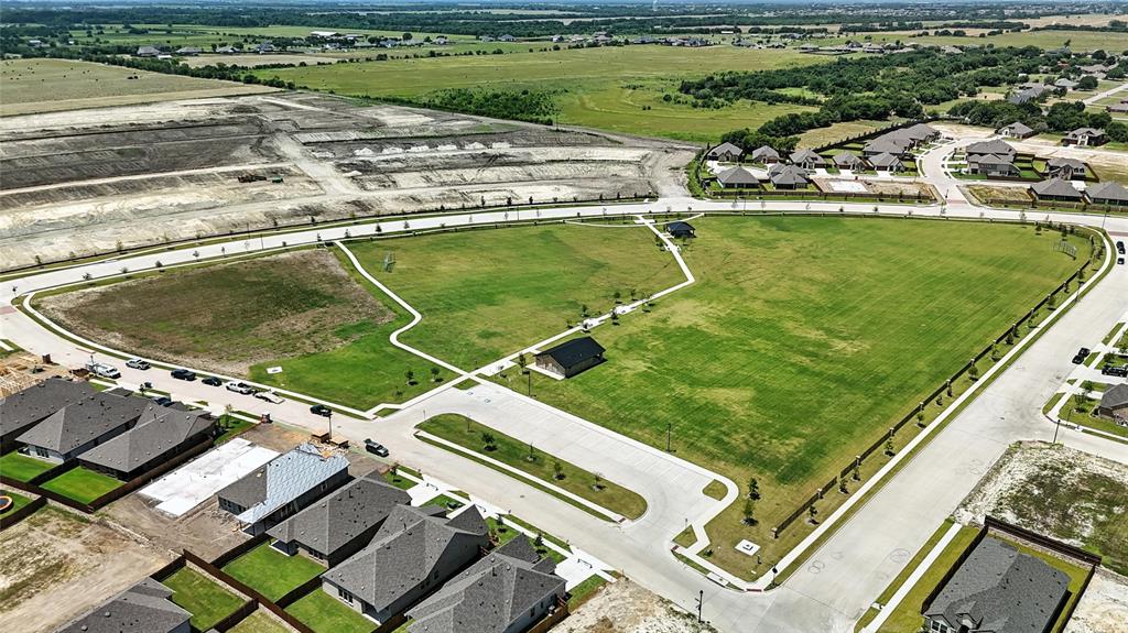 1246 Stockton Trail Red Oak, TX 75154 - Photo 27 of 29 a view of a swimming pool with a yard