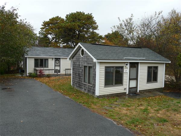 89 Glendon Road Dennis, MA 02639 - Photo 1 of 1 a view of a house with a yard plants and large tree