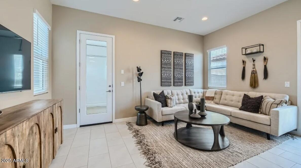 9915 South Dutchman Drive Apache Junction, AZ 85120 - Photo 12 of 27 a living room with furniture and a fireplace