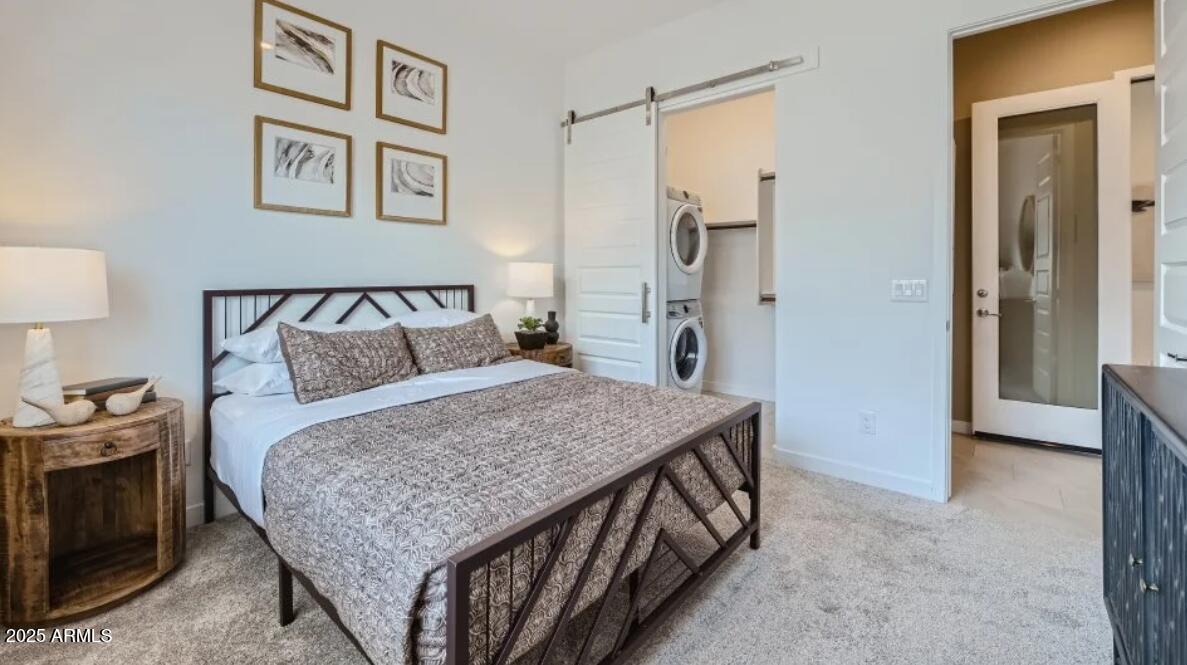 9915 South Dutchman Drive Apache Junction, AZ 85120 - Photo 13 of 27 a bedroom with a bed and a table in it