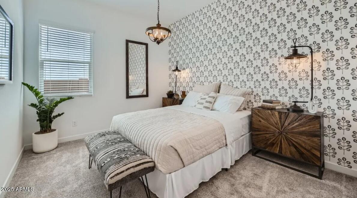 9915 South Dutchman Drive Apache Junction, AZ 85120 - Photo 17 of 27 a bedroom with bed and a potted plant