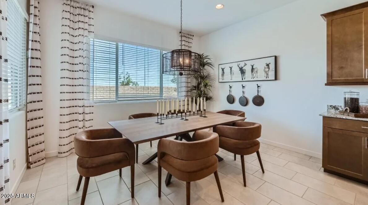 9915 South Dutchman Drive Apache Junction, AZ 85120 - Photo 4 of 27 a dining room with a table and chairs