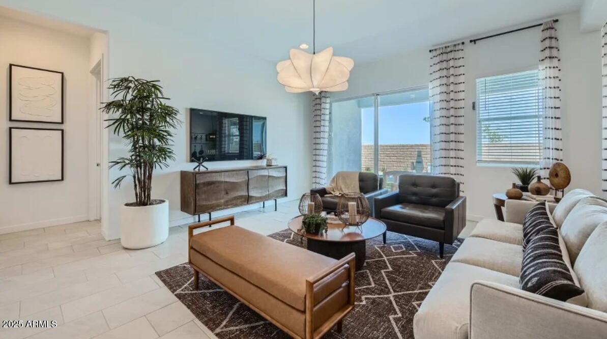 9915 South Dutchman Drive Apache Junction, AZ 85120 - Photo 5 of 27 a living room with furniture potted plant and a window