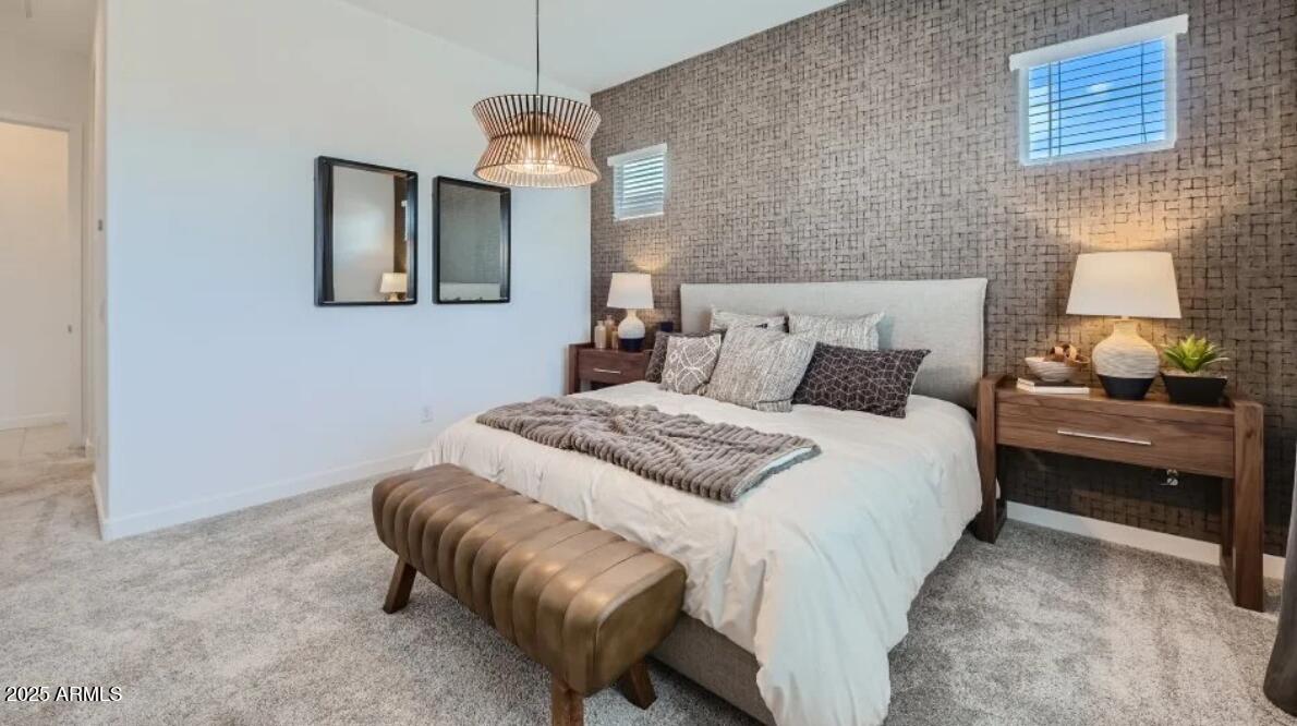 9915 South Dutchman Drive Apache Junction, AZ 85120 - Photo 7 of 27 a bedroom with a bed and a chandelier