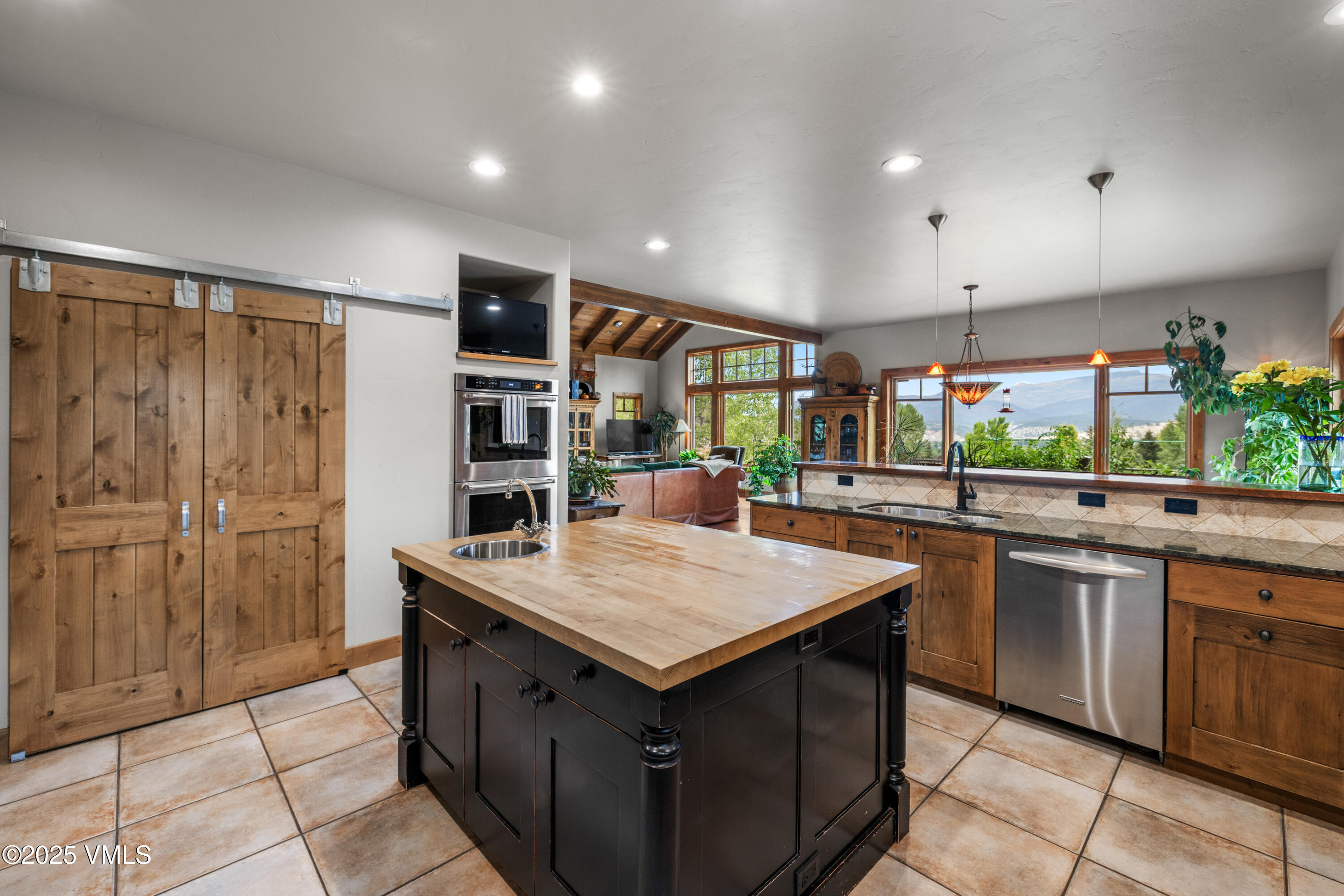 51 Silver Spur Eagle, CO 81631 - Photo 19 of 59 a kitchen with stainless steel appliances granite countertop a sink and a stove