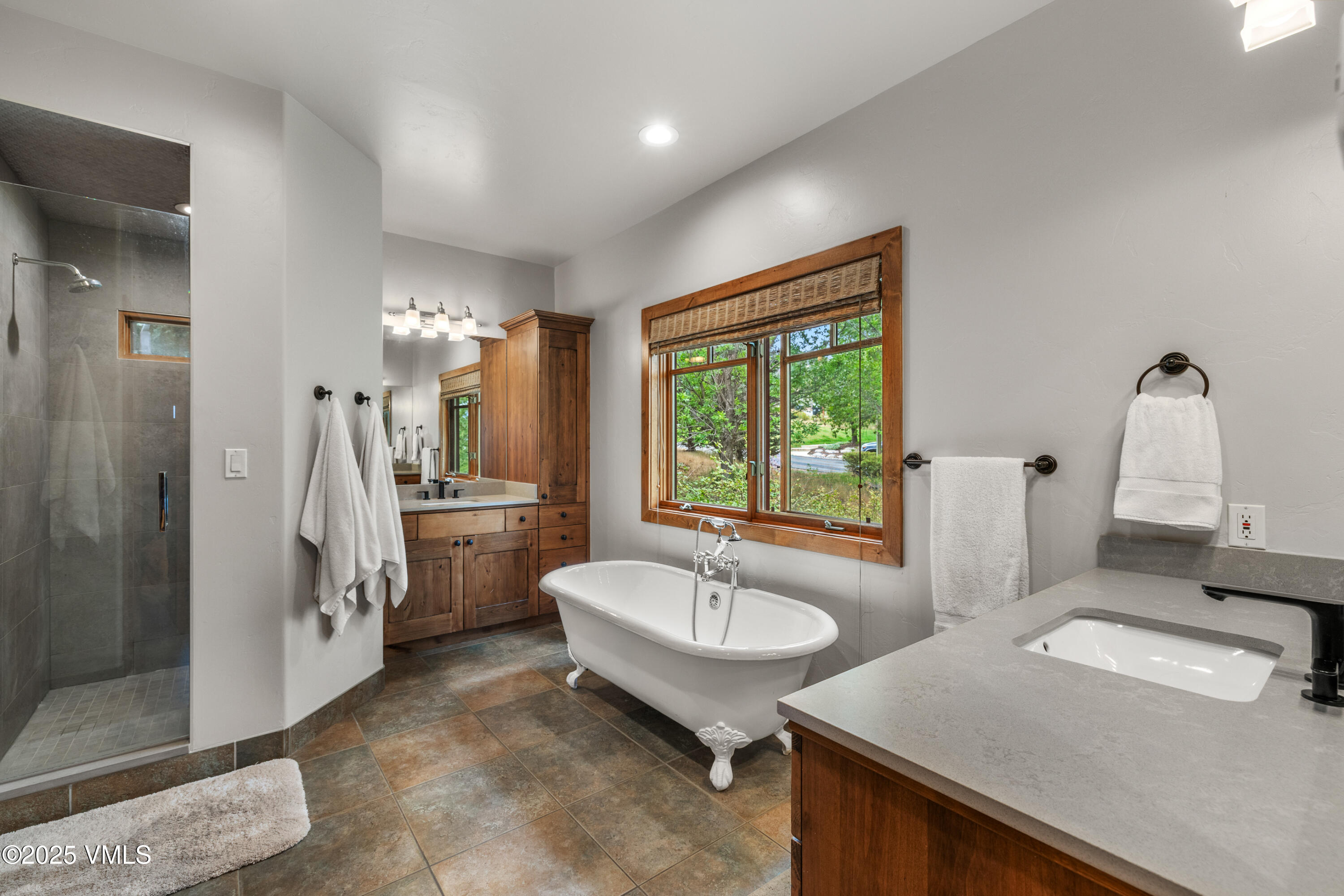 51 Silver Spur Eagle, CO 81631 - Photo 22 of 59 a spacious bathroom with a sink and a mirror