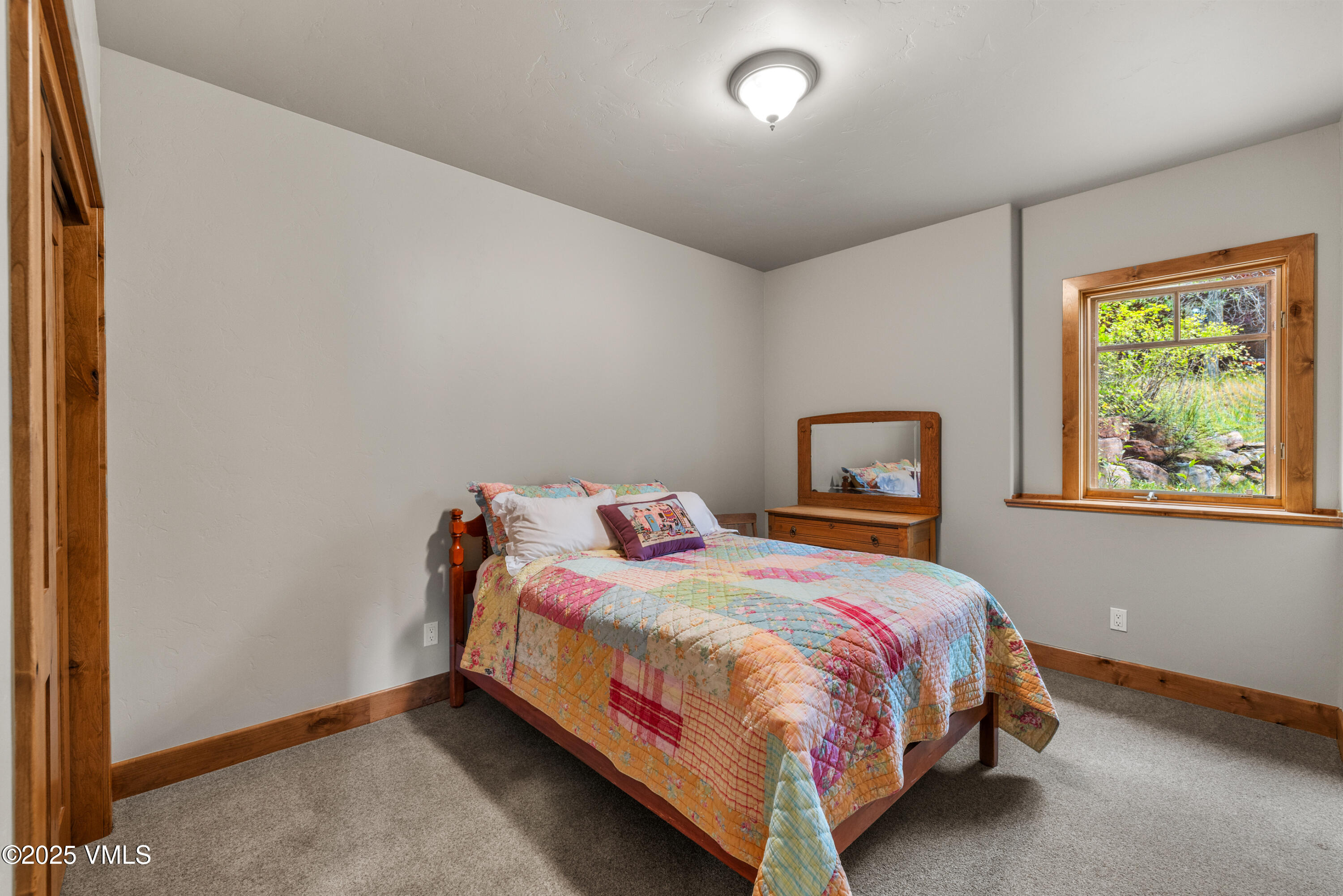 51 Silver Spur Eagle, CO 81631 - Photo 35 of 59 a bedroom with a bed and window