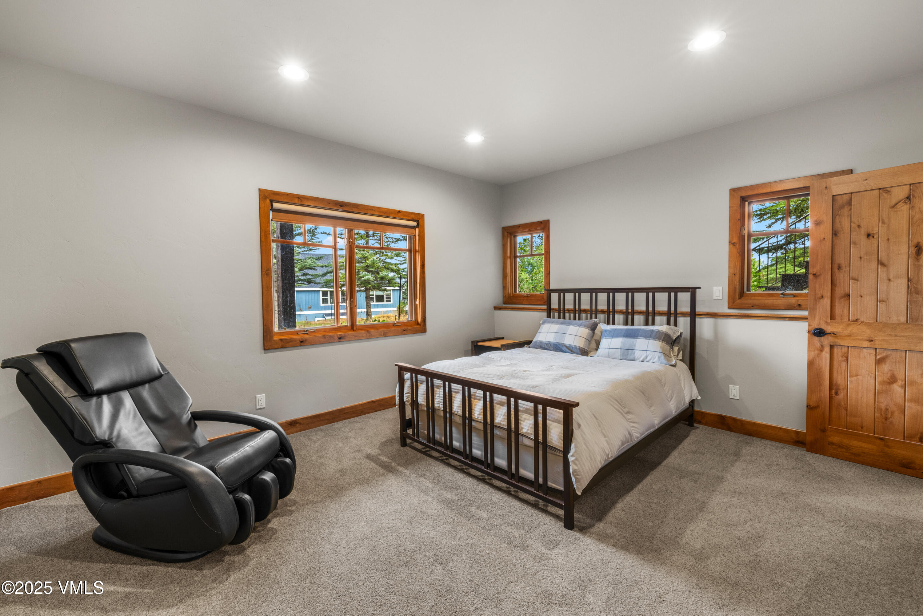 51 Silver Spur Eagle, CO 81631 - Photo 37 of 59 a bedroom with a bed chair and painting on the wall
