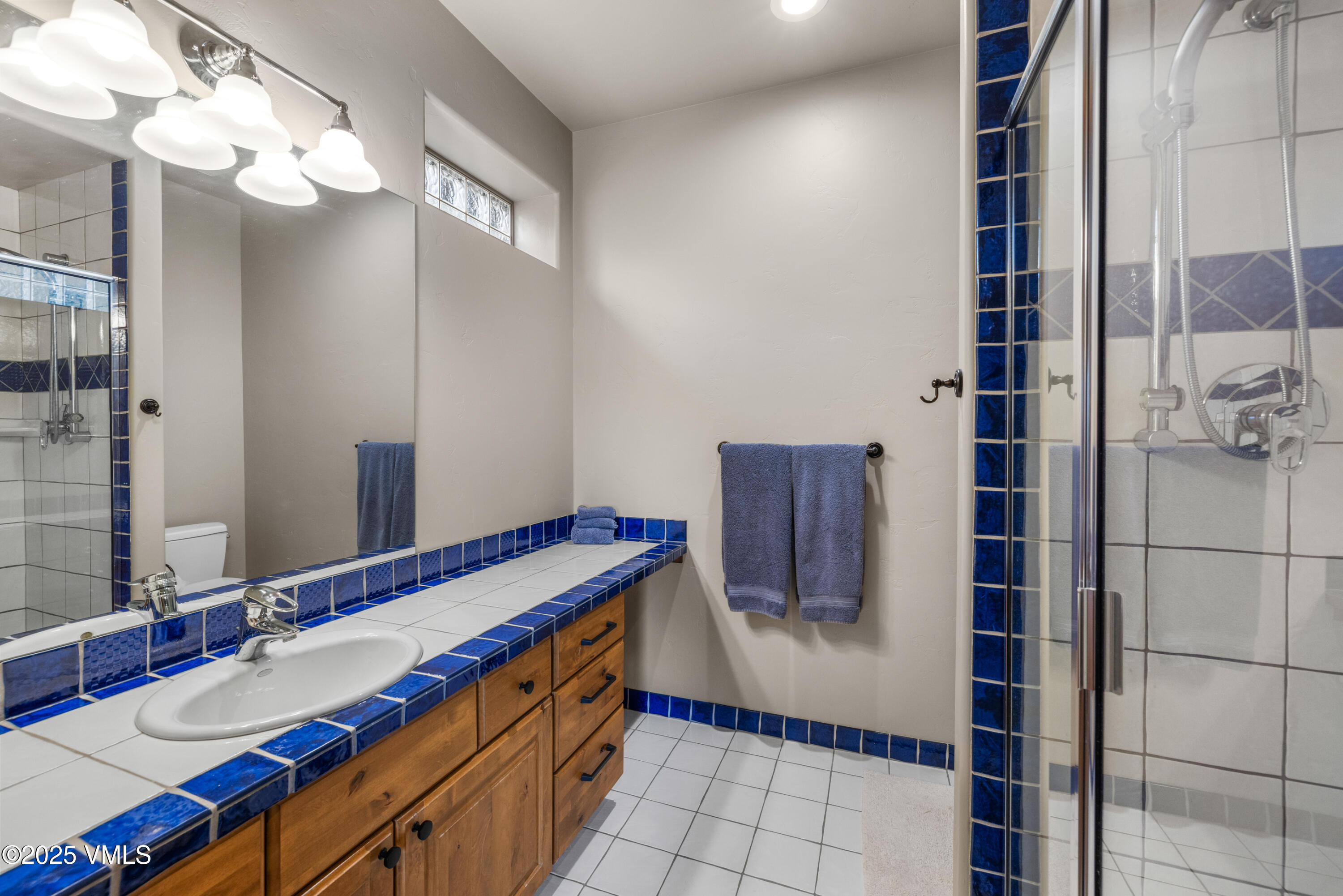 51 Silver Spur Eagle, CO 81631 - Photo 39 of 59 a bathroom with a sink and a mirror