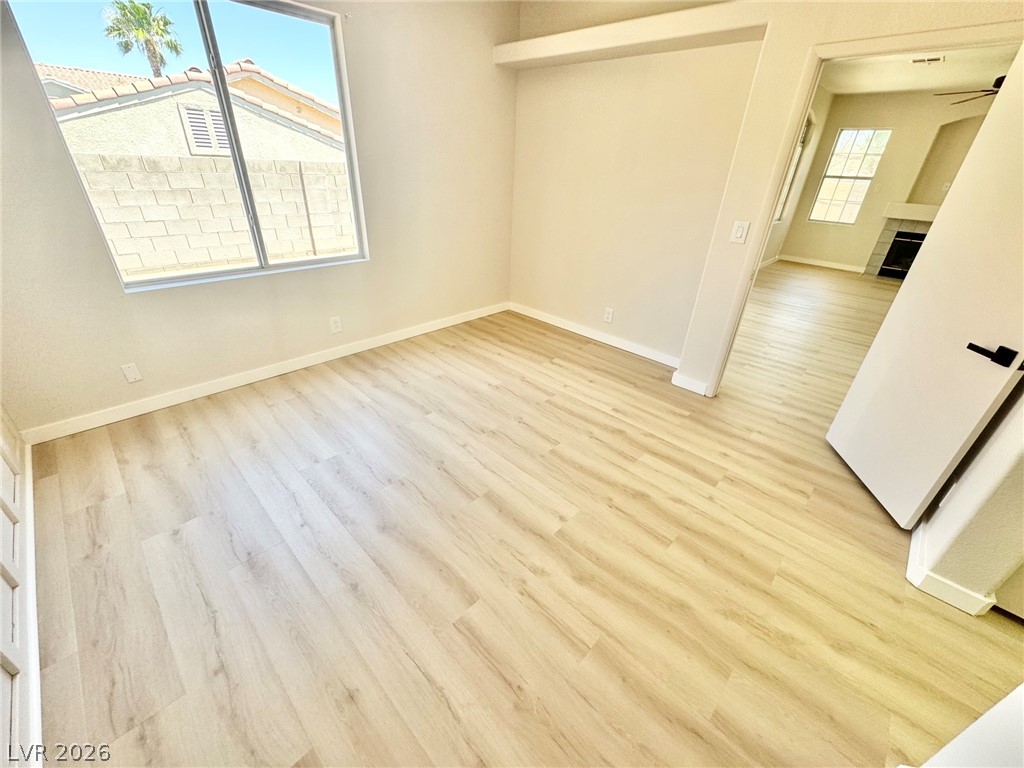 7340 Ridge Star Court Las Vegas, NV 89131 - Photo 17 of 22 Laminate flooring throughout offers a clean, contemporary feel with ample natural light from the large window.