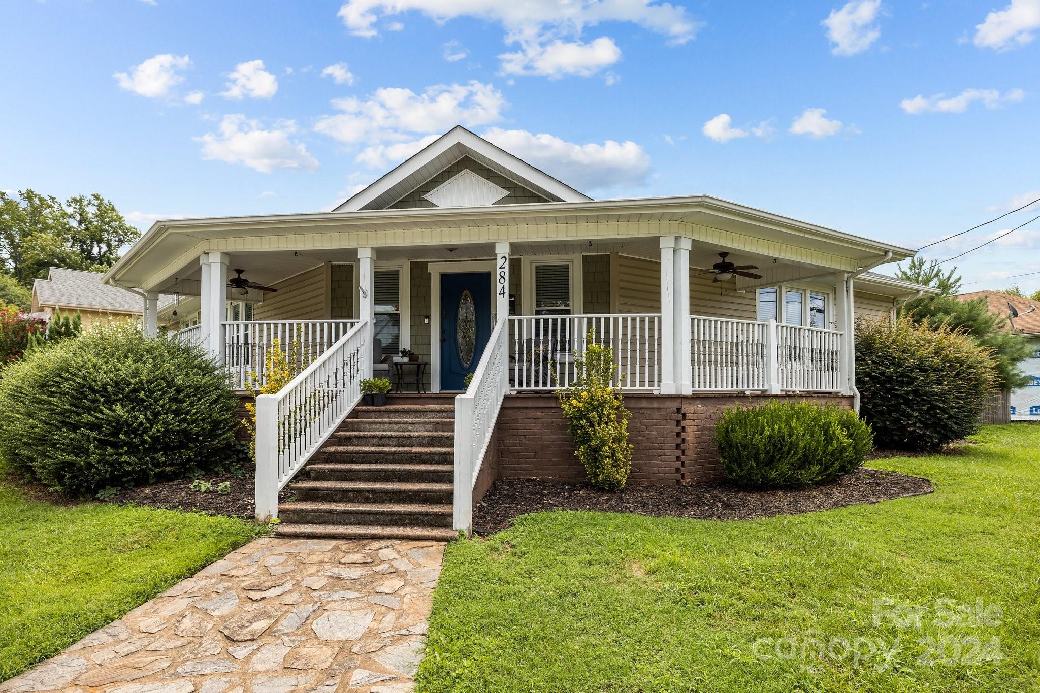 a front view of a house with garden