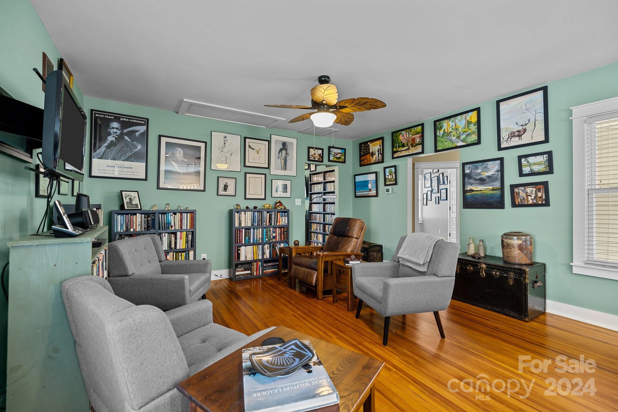 284 8th Avenue Cramerton, NC 28032 - Photo 11 of 29 a living room with furniture a rug and a flat screen tv
