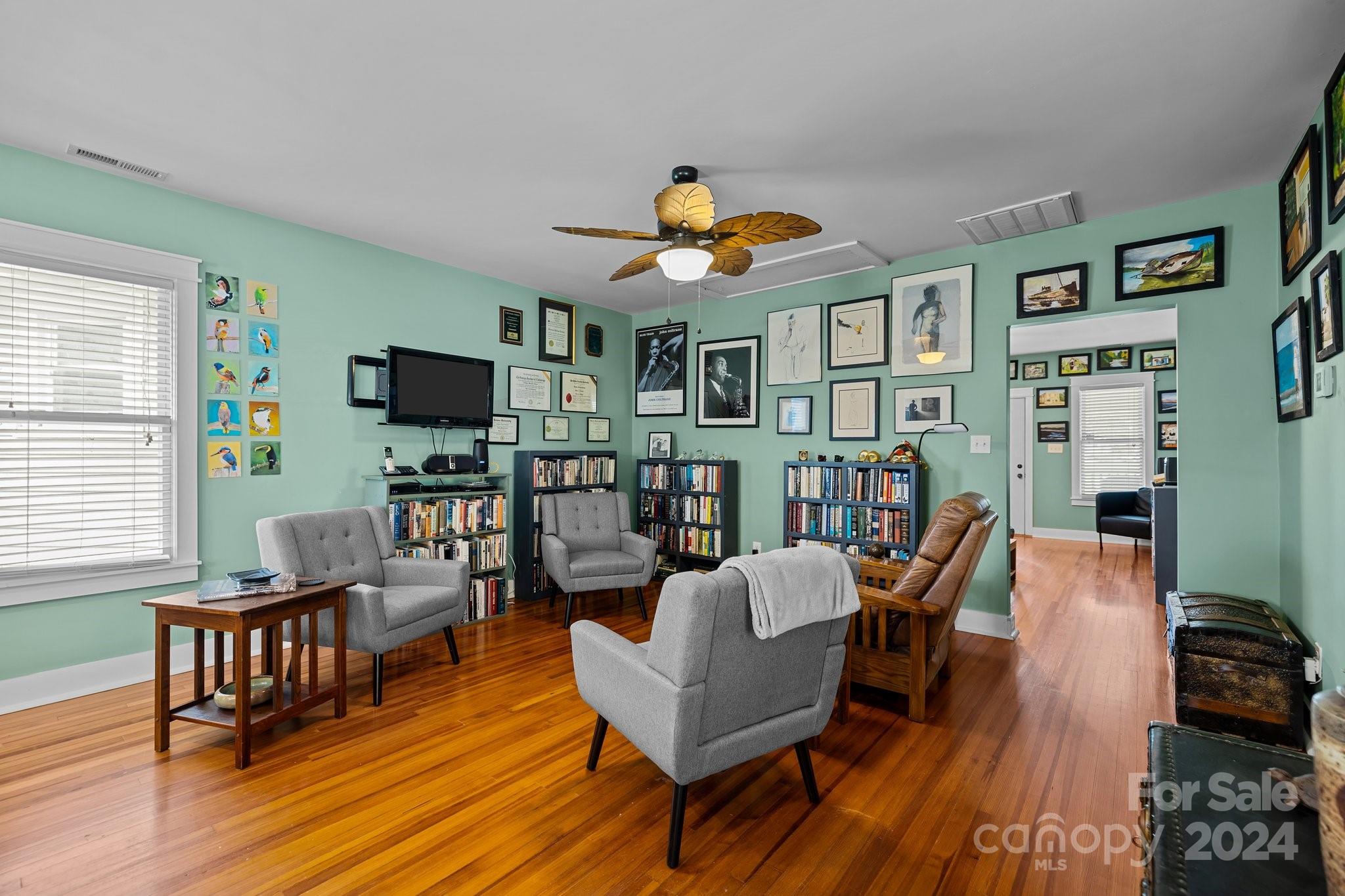 284 8th Avenue Cramerton, NC 28032 - Photo 12 of 29 a living room with furniture and a flat screen tv