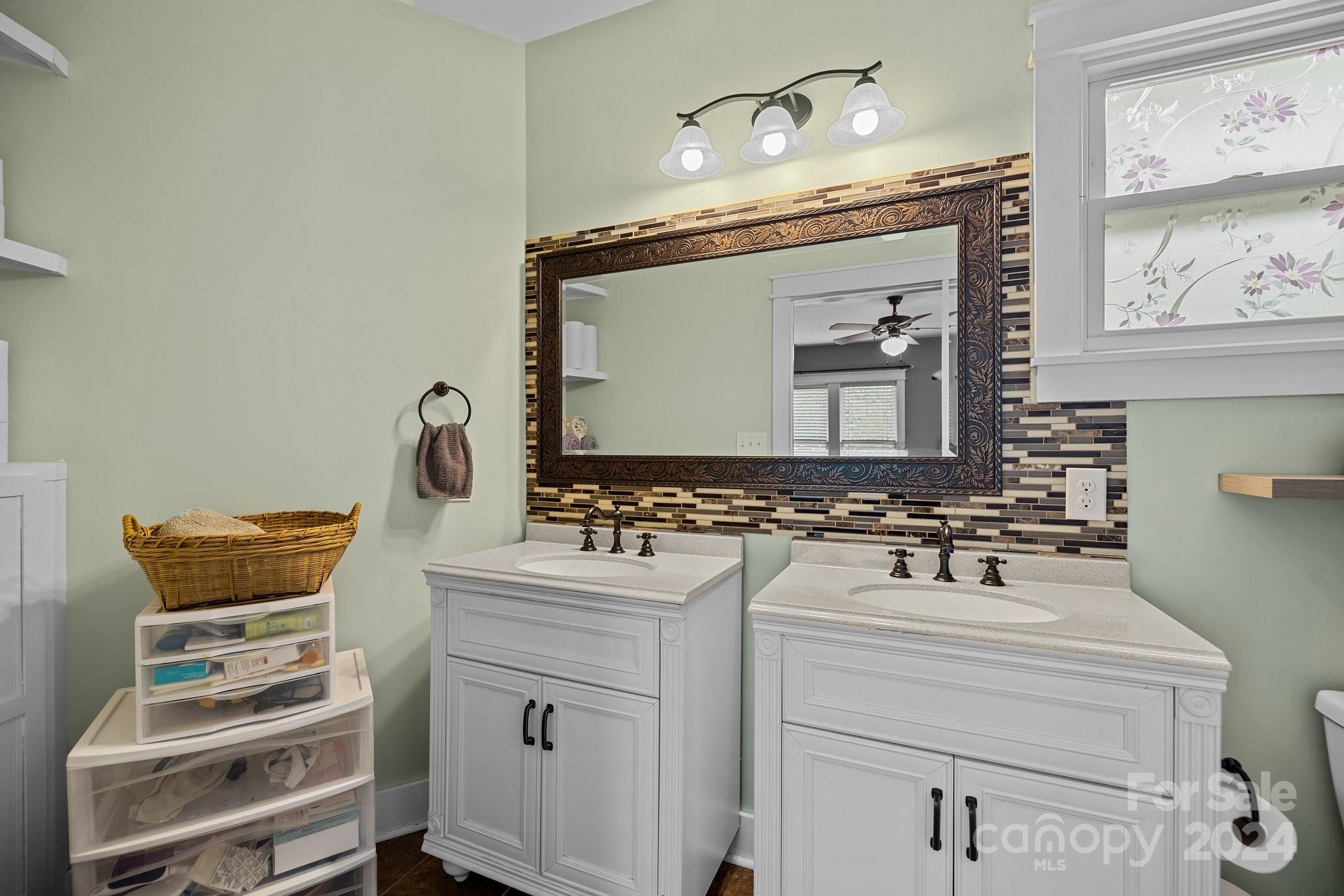 284 8th Avenue Cramerton, NC 28032 - Photo 15 of 29 a bathroom with a sink and a mirror