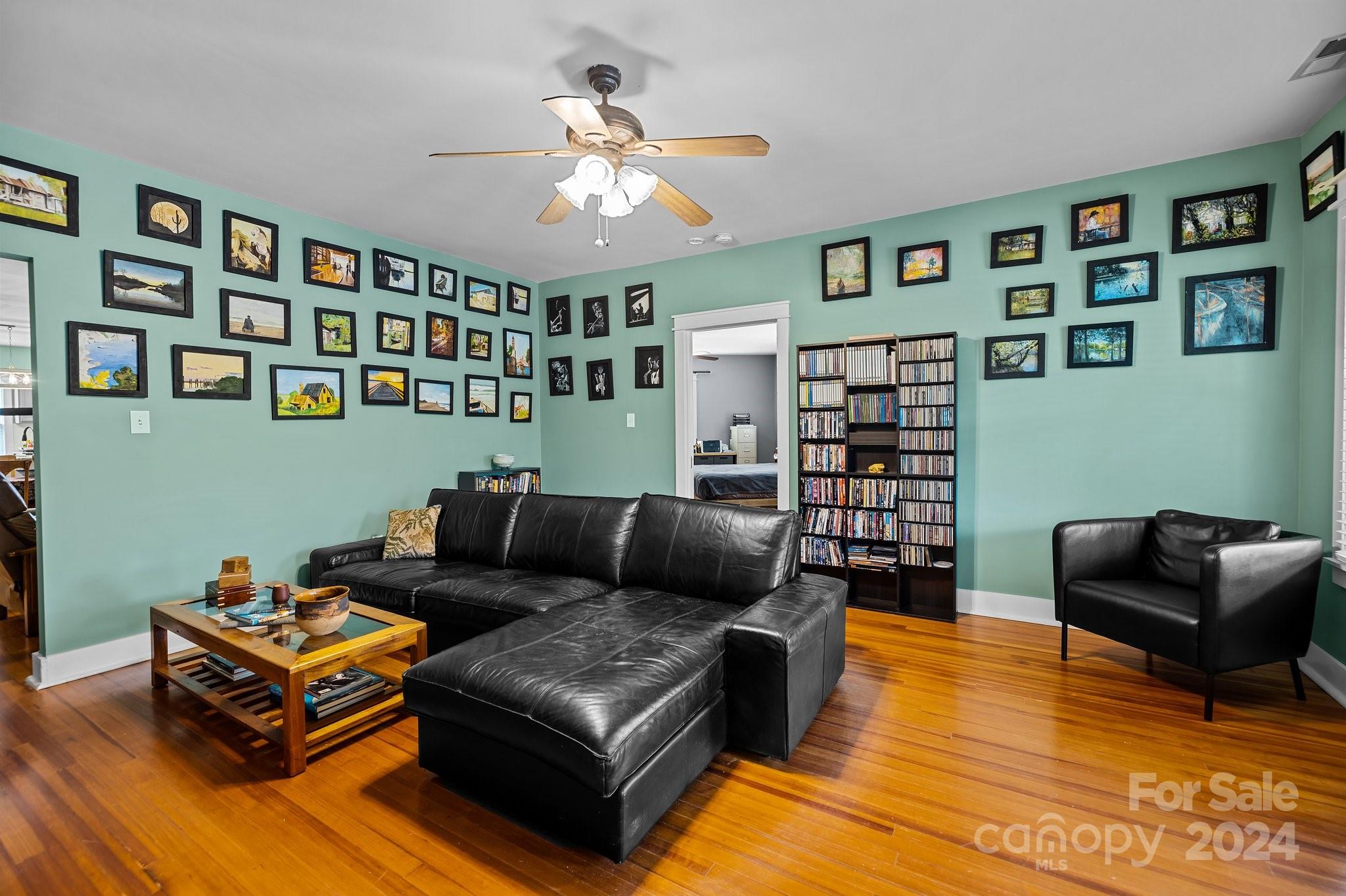 284 8th Avenue Cramerton, NC 28032 - Photo 21 of 29 a living room with furniture and painting on the wall