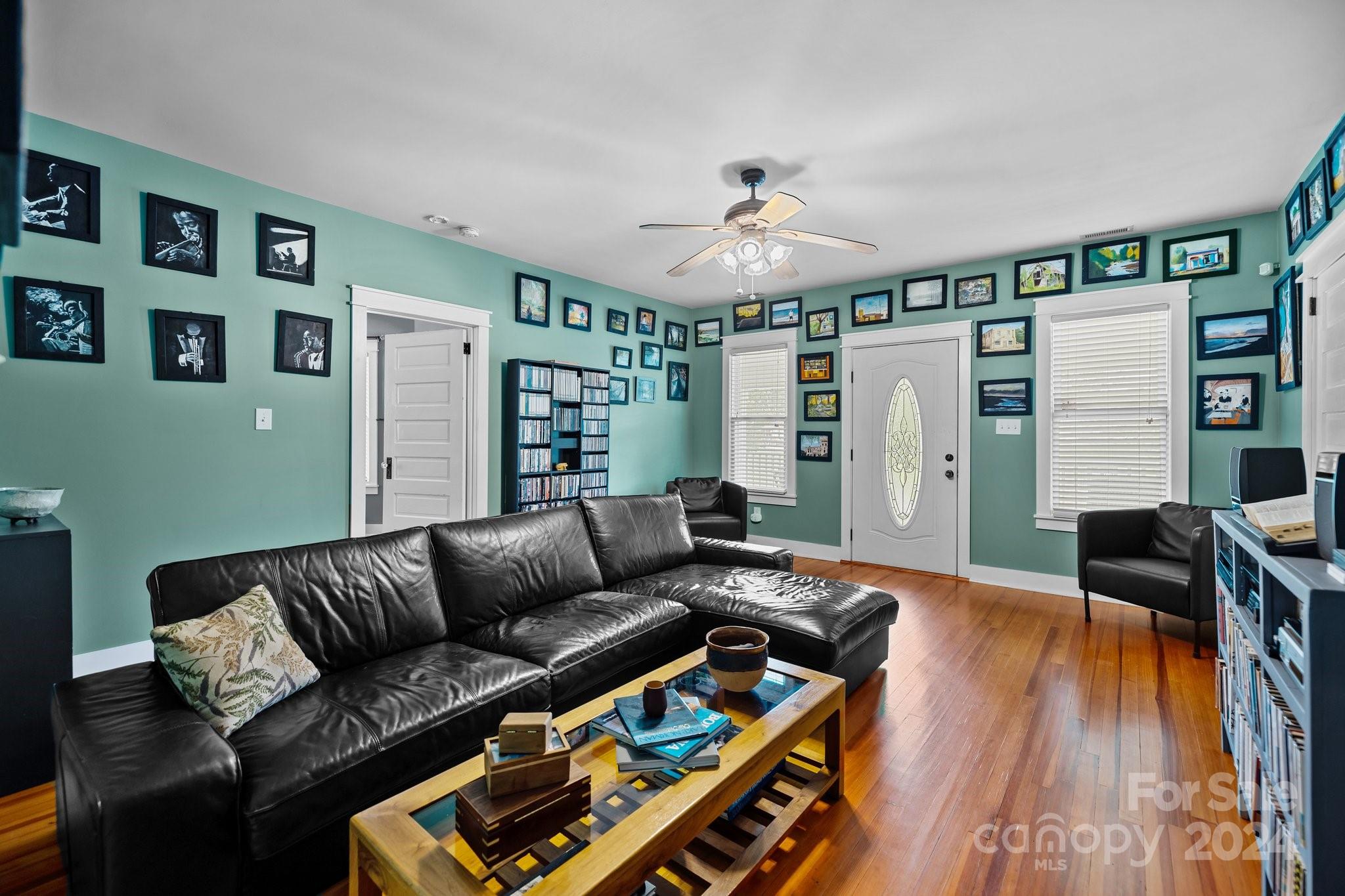284 8th Avenue Cramerton, NC 28032 - Photo 22 of 29 a living room with furniture and a flat screen tv