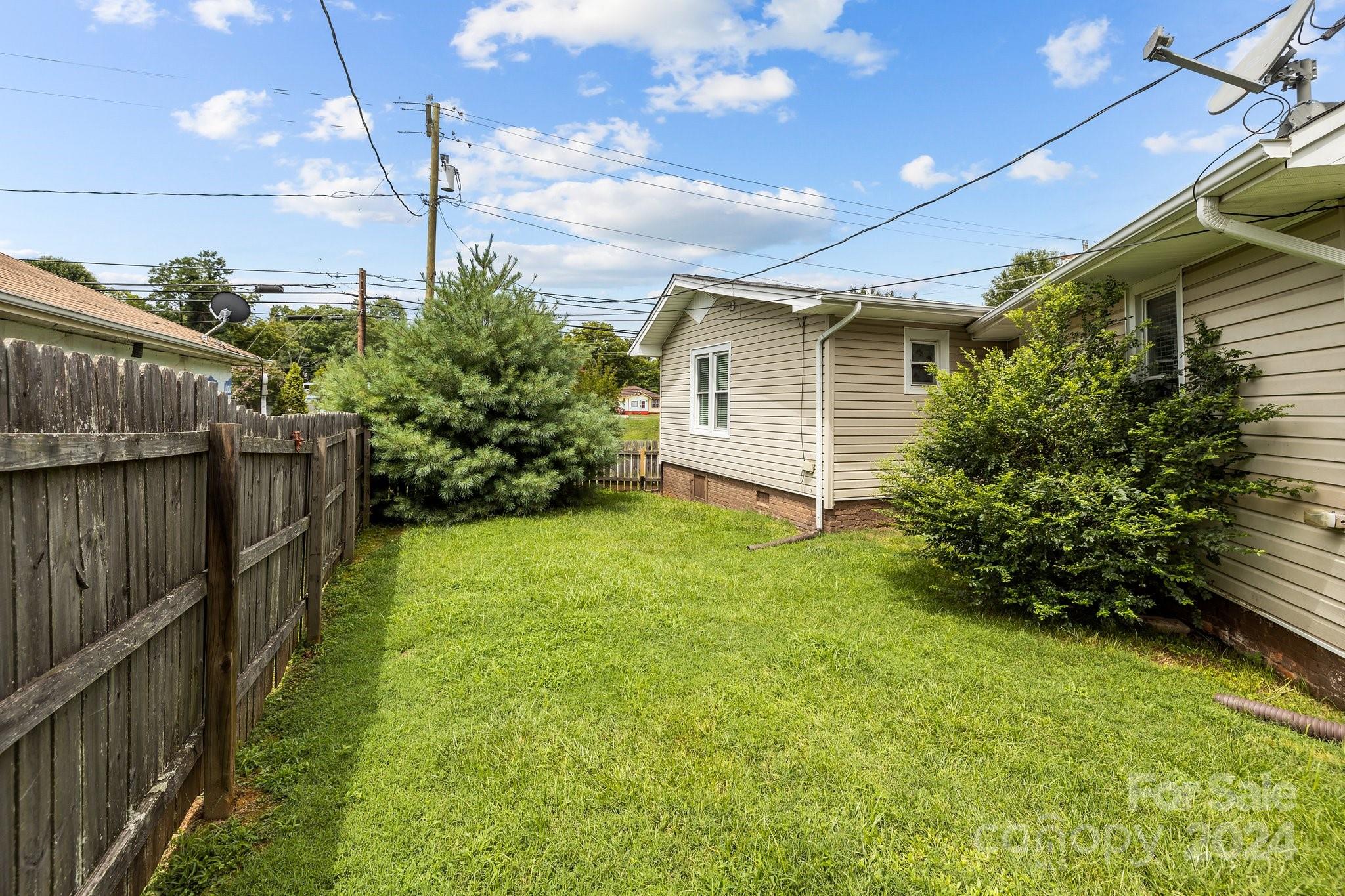 284 8th Avenue Cramerton, NC 28032 - Photo 26 of 29 a yellow house with garden in front of it