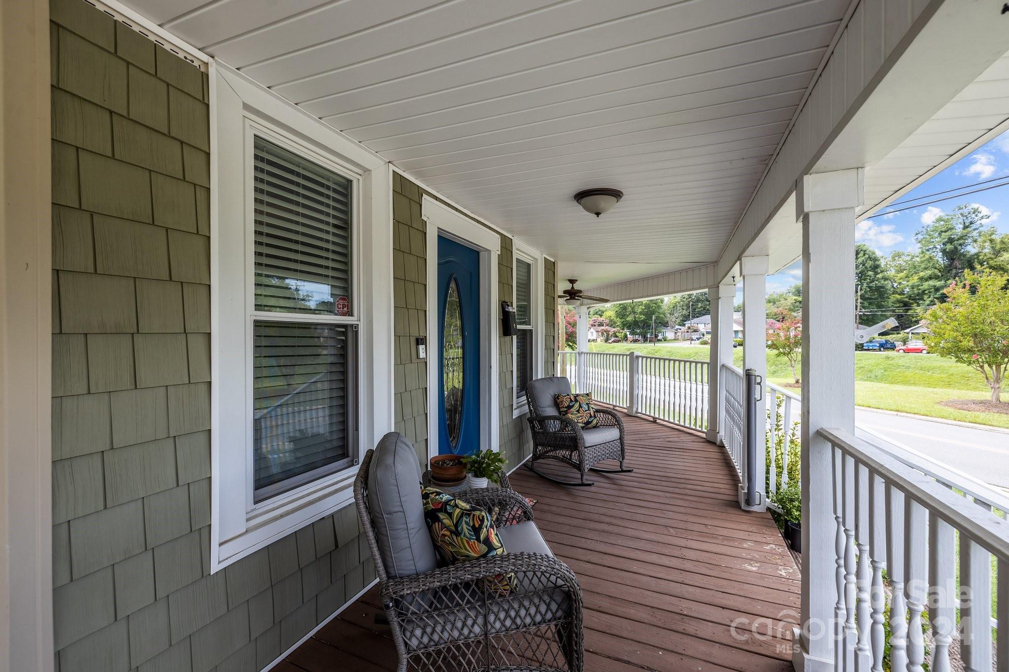 284 8th Avenue Cramerton, NC 28032 - Photo 3 of 29 a view of a balcony with chairs and a table