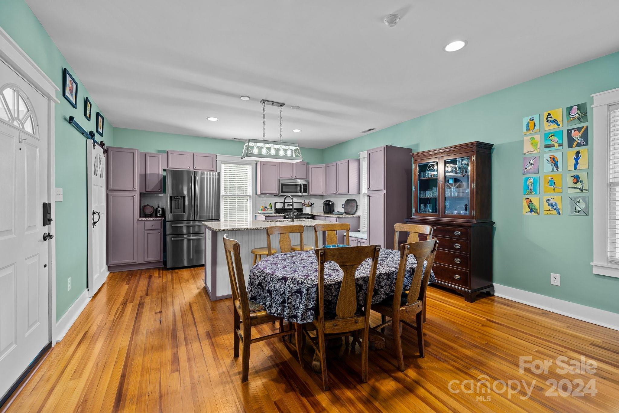 284 8th Avenue Cramerton, NC 28032 - Photo 4 of 29 a view of a dining room with furniture and wooden floor
