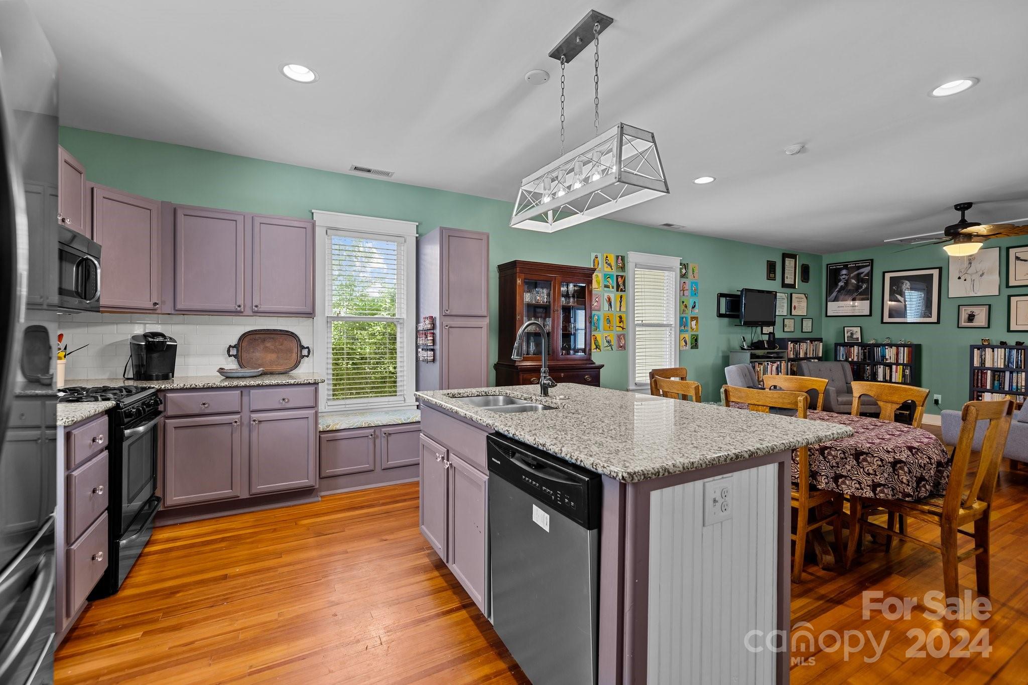 284 8th Avenue Cramerton, NC 28032 - Photo 6 of 29 a kitchen with stainless steel appliances granite countertop a kitchen island a stove and a sink