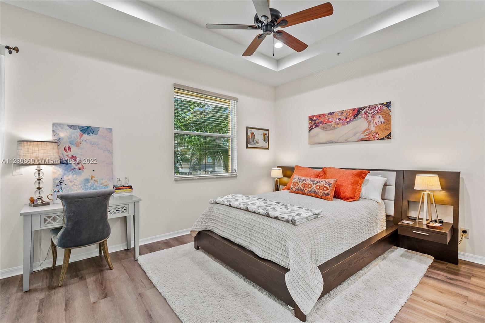 4332 Main Street Jupiter, FL 33458 - Photo 16 of 28 a bedroom with a large bed and a chandelier