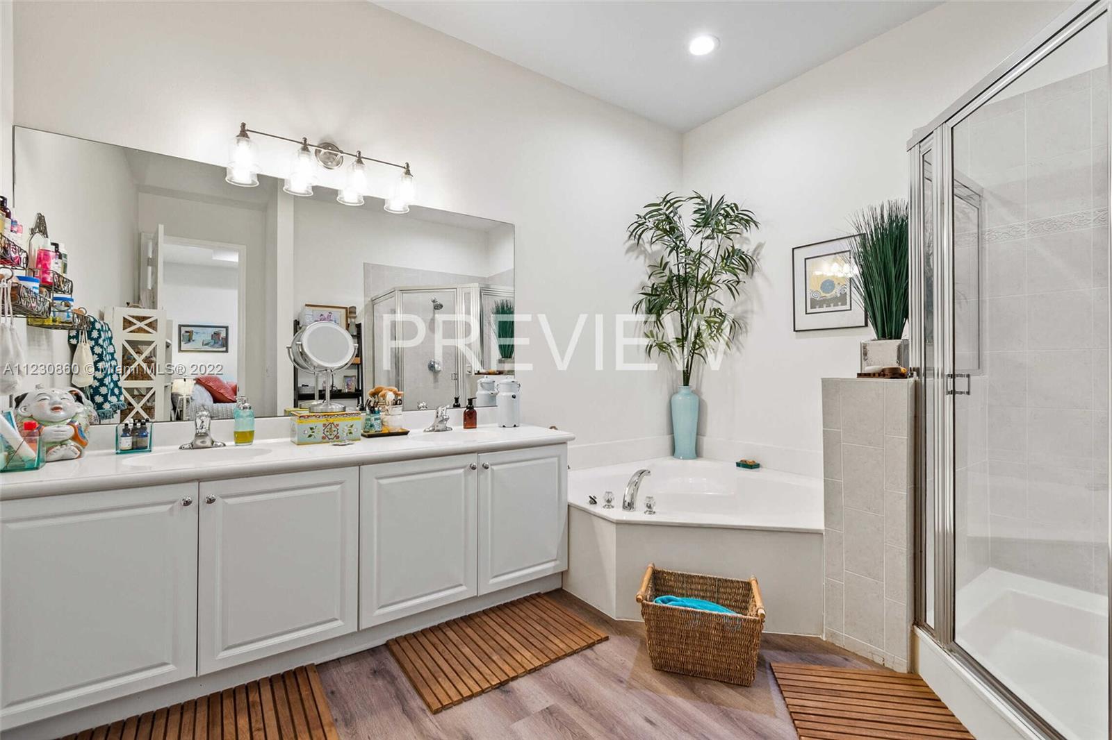 4332 Main Street Jupiter, FL 33458 - Photo 18 of 28 a bathroom with a sink and a mirror