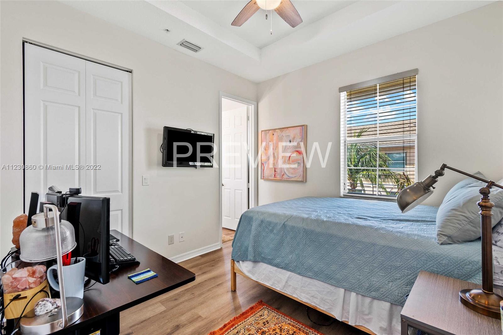 4332 Main Street Jupiter, FL 33458 - Photo 19 of 28 a bedroom with a bed and a window