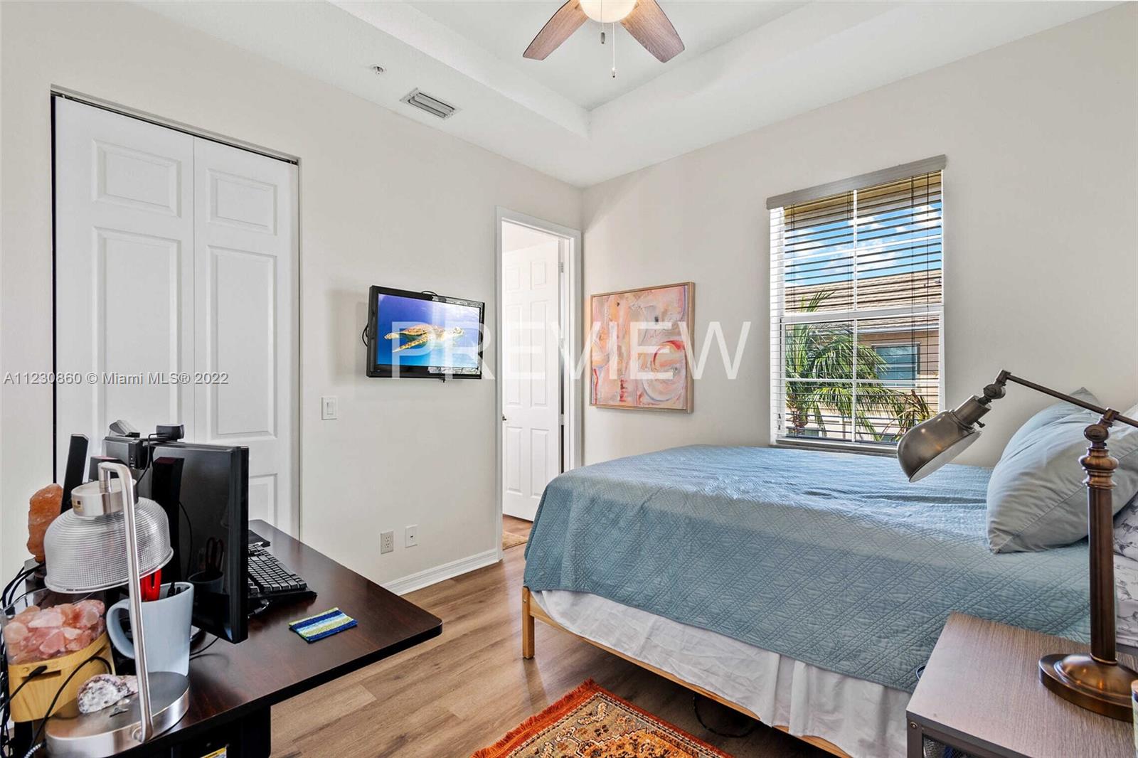 4332 Main Street Jupiter, FL 33458 - Photo 20 of 28 a bedroom that has a bed and a window in it