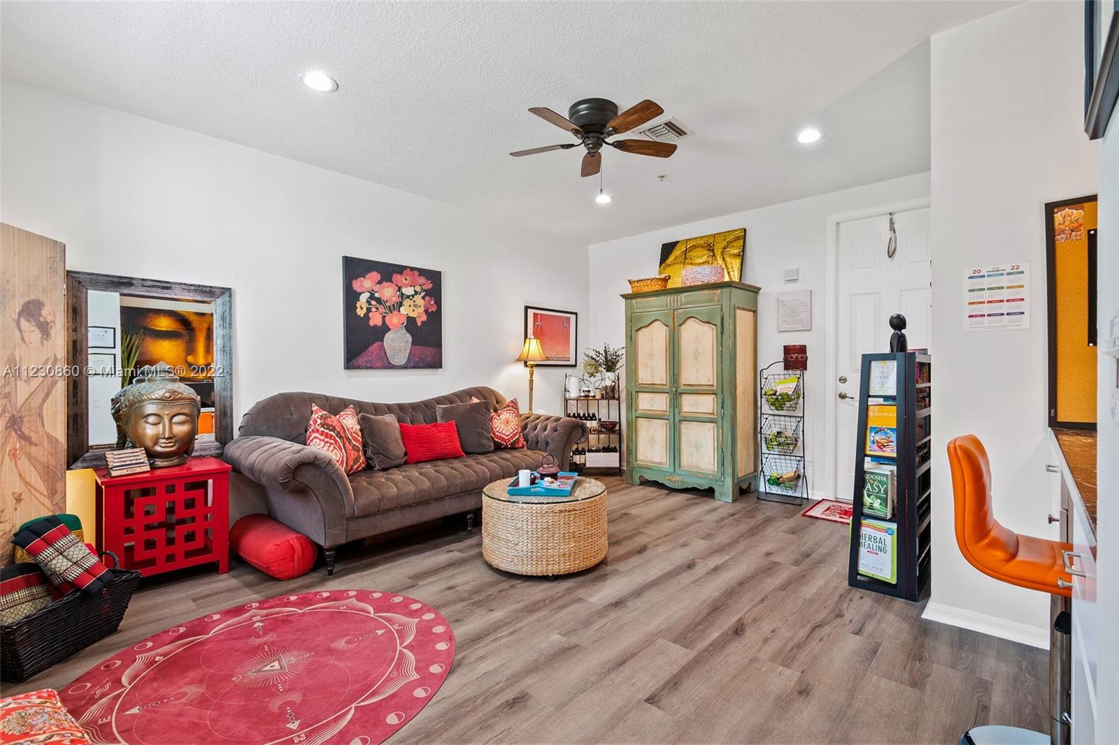 4332 Main Street Jupiter, FL 33458 - Photo 4 of 28 a living room with furniture and a couch