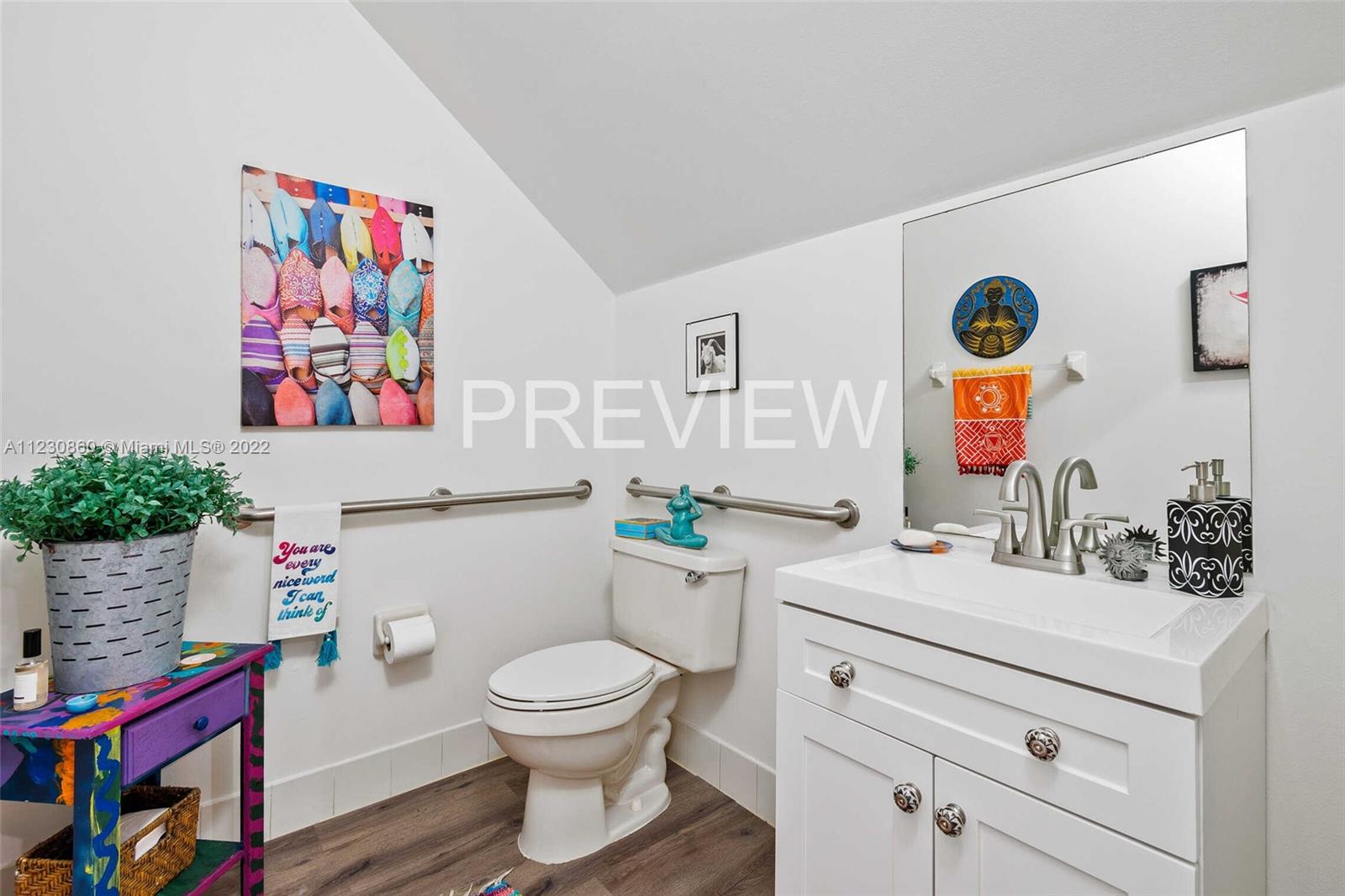 4332 Main Street Jupiter, FL 33458 - Photo 5 of 28 a bathroom with a sink mirror vanity and toilet