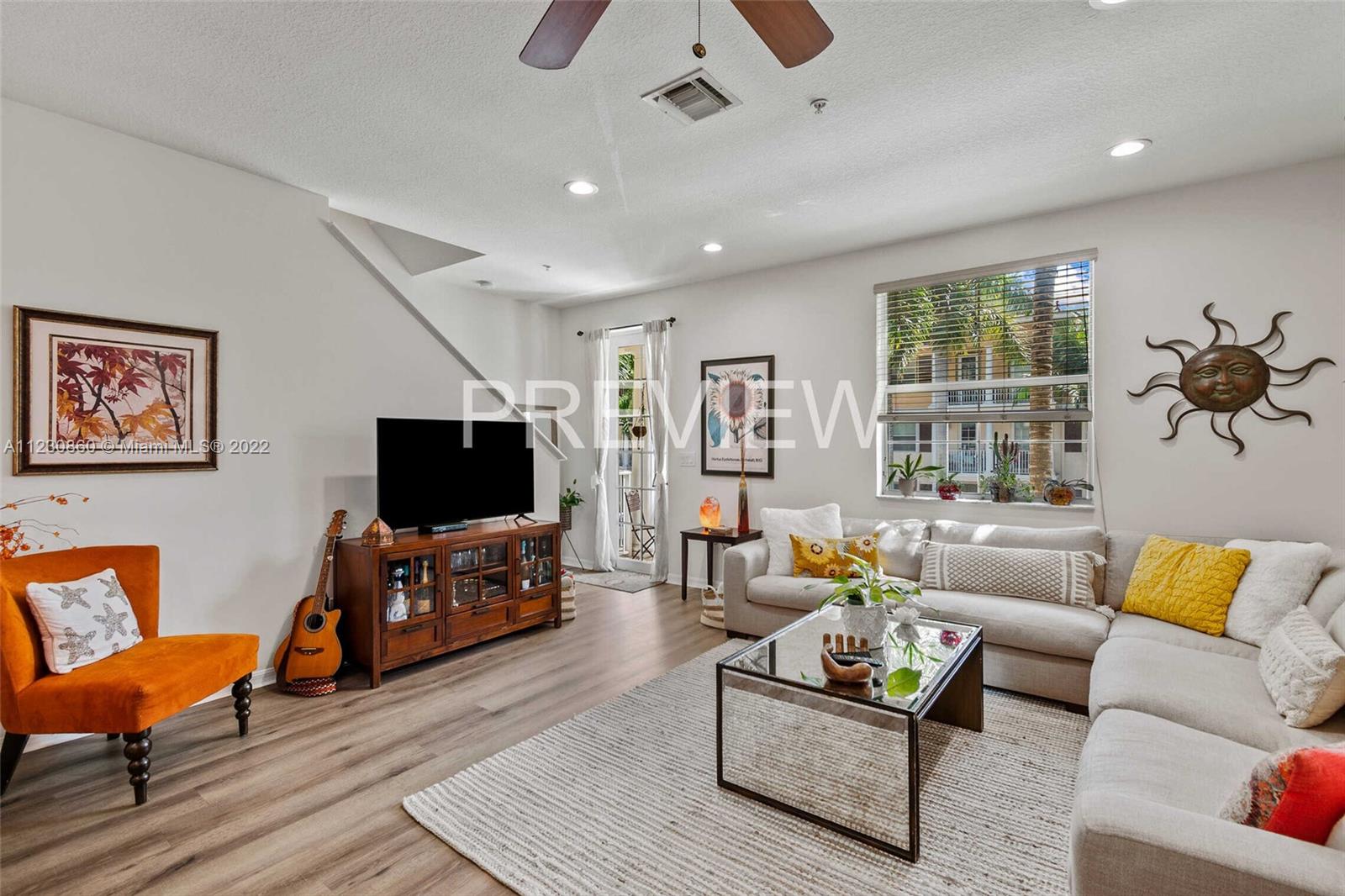 4332 Main Street Jupiter, FL 33458 - Photo 8 of 28 a living room with furniture and a flat screen tv