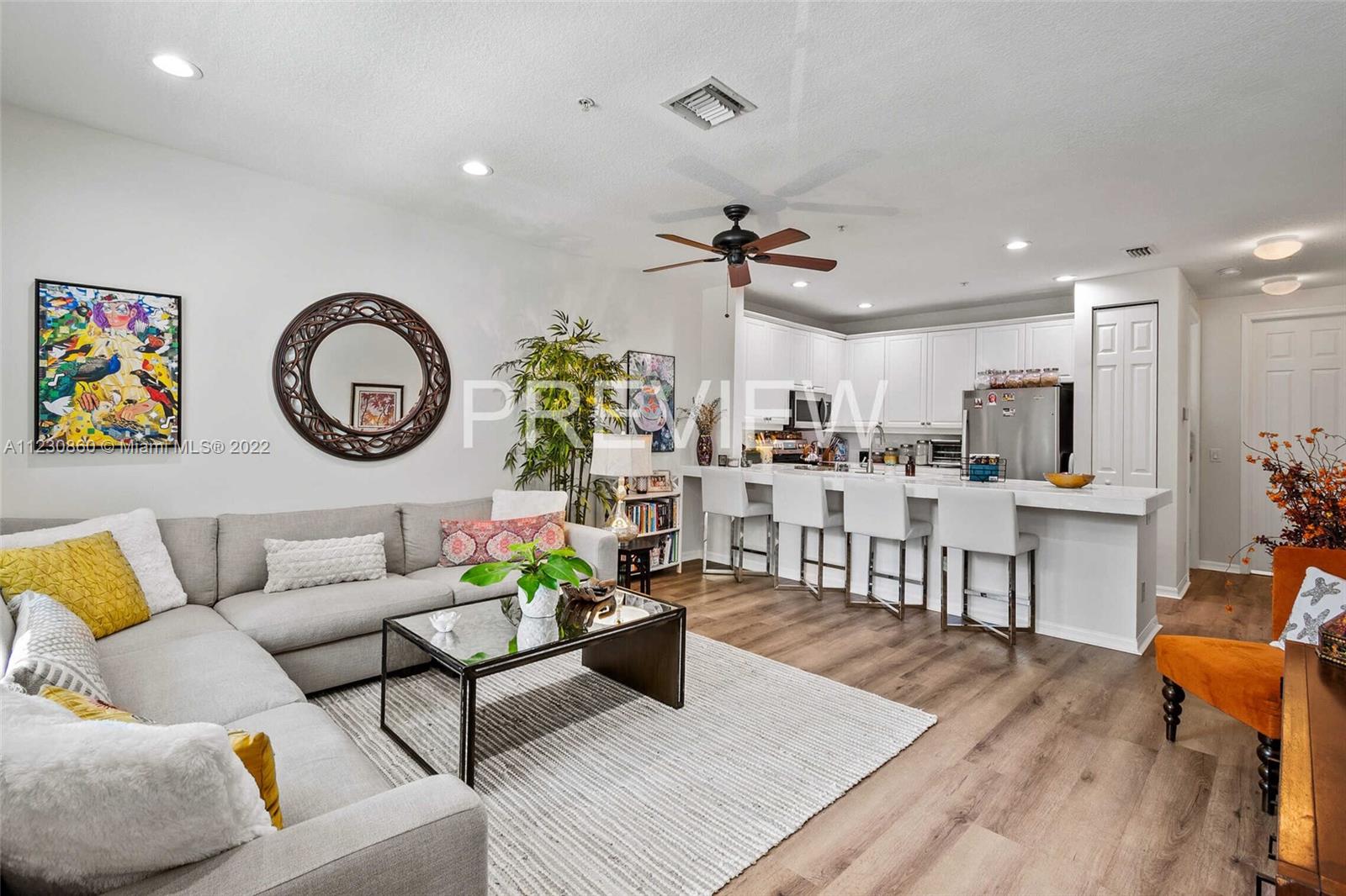 4332 Main Street Jupiter, FL 33458 - Photo 9 of 28 a living room with furniture and kitchen view