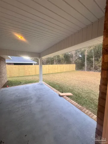 a view of an empty room with a ocean view