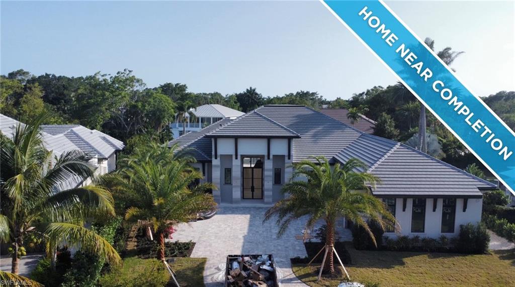 560 Rudder Road Naples, FL 34102 - Photo 1 of 23 an aerial view of a house