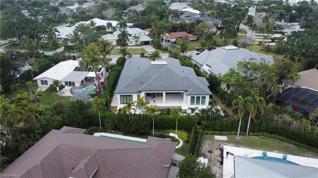560 Rudder Road Naples, FL 34102 - Photo 14 of 23 an aerial view of a house with garden space and street view